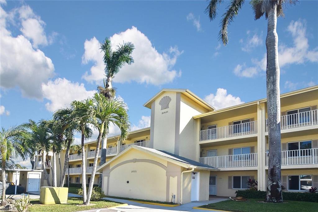 Please check out the virtual tour. Spectacular long lake view!  This lovely condo is light and bright and shows beautifully—immaculate and freshly painted interior.  Take the elevator to your top-floor residence, offering high vaulted ceilings, a generous screened-in lanai, two spacious bedrooms, two full bathrooms, a covered carport, and an outside storage unit.  This home also offers neutral tile, with new carpet in both bedrooms. The inside has been impeccably maintained, and the furniture is included. Breckenridge offers tremendous value, and the location is ideally situated in the desirable Estero area. Executive golf is included, but if you aren’t a golfer, this active community has something for everyone - bocce, tennis, pickle ball, shuffleboard, resort-style pool, fitness center, spacious community/event room, kids play area, RV storage (check for availability) and more!