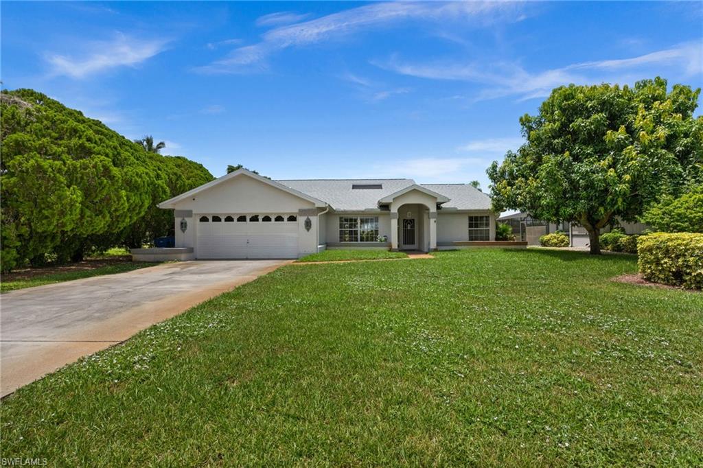 Here's your chance to put your personal touch on a home with serious potential. This 1,900 sq ft, 3-bedroom, 2-bath pool home greets you with a unique atrium entry that you won't find in cookie-cutter floor plans. The home features a spacious layout with great bones throughout. The eat in kitchen has already been nicely updated with a beautiful glass tile backsplash, new cabinetry, and modern light fixtures and flows into a spacious family room with vaulted ceilings and a charming corner fireplace.  The split floorplan is perfect for privacy and convenience offering a large primary suite overlooking the pool area. The primary bath features double sinks and a beautiful walk in shower.  Outside enjoy the large lanai (with hurricane shutters) built-in pool with a screened cage and fenced yard overlooking the serene setting of the San Carlos golf course. A long concrete driveway offers ample parking and leads to the attached 2-car garage. With solid structure, a fantastic layout, and an unbeatable golf course location, this home is ready for a bit of cosmetic TLC to make it truly shine. Priced to reflect the opportunity don't miss your chance to build equity in this sought-after setting!  Super convenient location close to Gulf Coast Town Center, restaurants, beaches, RSW airport, shopping and more!