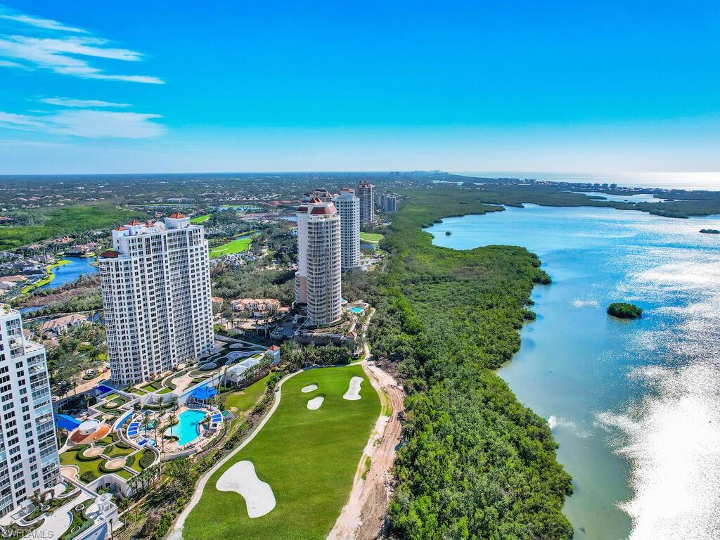 Luxury high rise living at its finest located in amenity rich Bonita Bay. The elevator opens to your private foyer on the 24th floor in the Esperia South building. The expansive views of Estero Bay and the Gulf of Mexico are captivating from the moment you walk in. This unit features 3 bedrooms, including a master suite with custom closets, 3 full baths, and a private terrace that is accessible from both the living room and the master bedroom. Open floor plan, marble flooring throughout the main living area, Crowne moulding and custom window treatments. This well appointed home includes a private 2nd floor 2 car garage with additional storage. Esperia features a private club house with resort-style pool, spa, cabana, billiards room, fitness center and theater on site. Bonita Bay club is an optional membership which provides 5 world-class golf courses, tennis, pickle ball, clubhouse and fitness center, marina with a restaurant as well as private beach access. Begin living your ultimate lifestyle today.