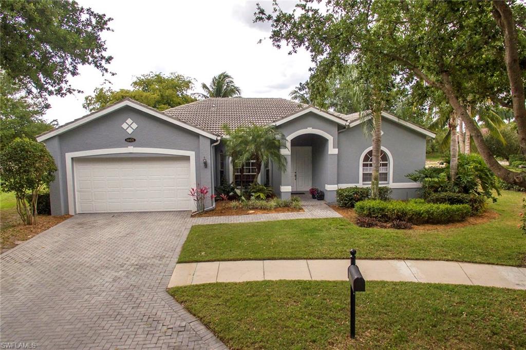 This home is in one of the best locations in Indigo Lakes, located at the end of the cul-de-sac on an oversized lakefront lot. This updated four-bedroom home has three full baths, tile and hardwood flooring throughout, two spacious and separate living rooms and formal and informal dining areas. Features of this home include white cabinets in the kitchen, newer stainless steel appliances, along with updates in the bathrooms, crown molding, closet organizers and fresh paint inside and out. The master bedroom features a light-filled sitting room or office area with lovely pool and lake views. Outside, there is an oversized screened-in pool and a wood ceiling on the lanai, along with an extra-deep two-car garage. Indigo Lakes is a gated community just east of I-75 with low HOA fees and great amenities, including a clubhouse with two social rooms, large swimming pool, exercise facility, tennis and basketball courts and a playground. It is located close to top-rated schools, shopping, dining and all that Naples has to offer.