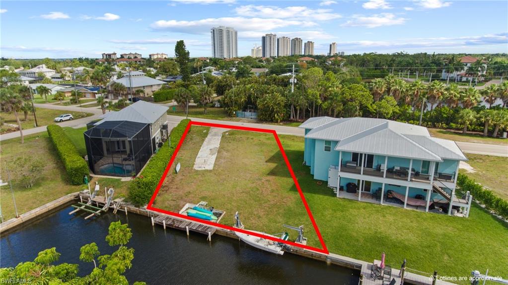 Rare Waterfront Opportunity in Bonita Springs! Build your dream coastal retreat on this exceptional, cleared gulf-access canal lot located at 4575 Spring Creek Dr. Offering an impressive 75 feet of prime water frontage, this oversized 0.21-acre (10,867 sq ft) property is a boater and nature lover’s paradise. The property comes equipped with an existing concrete seawall and wooden dock providing the perfect launchpad for your boat, kayaks, or jet skis. Navigate the scenic waterways right from your backyard out to the Gulf of Mexico, or explore nearby Mound Key Historic State Park. Situated in a highly desirable, rapidly transitioning West of US-41 location, you are just minutes from pristine SWFL beaches, premier dining, and shopping at Coconut Point Mall. With the previous structure fully cleared and demolished, this vacant canvas is entirely ready for your custom stilt home or coastal design. Don't miss the chance to own a piece of waterfront paradise where high-rise skyline views meet quiet canal living!