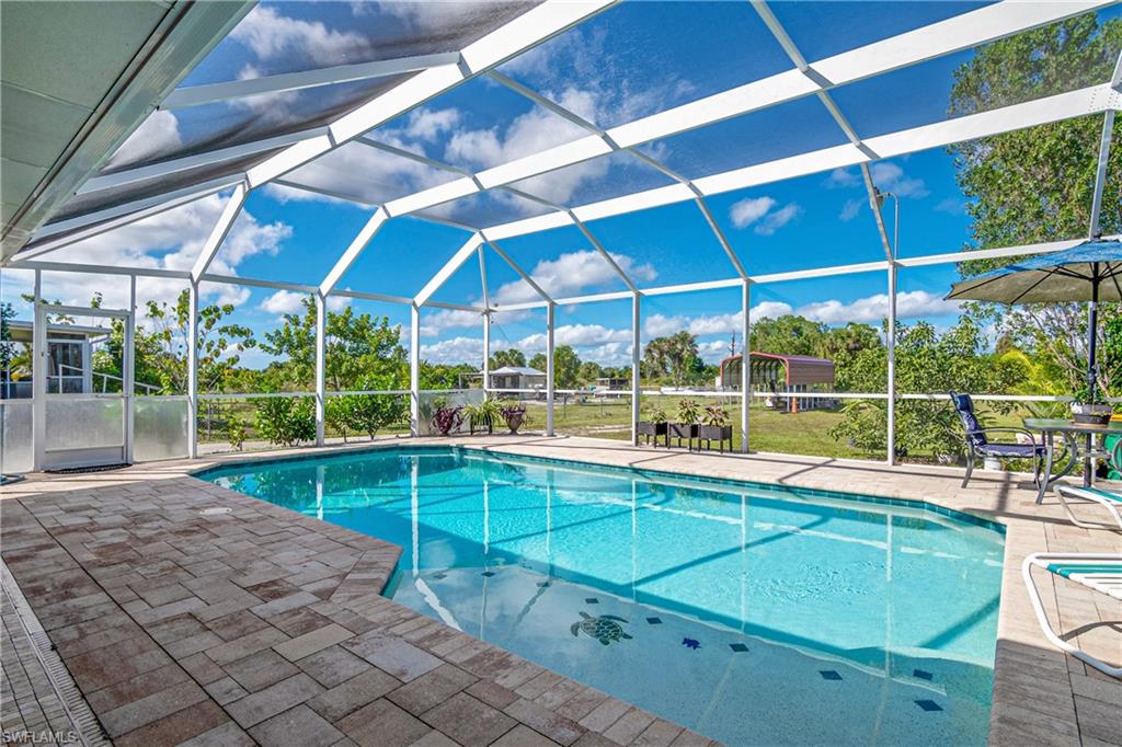 MOTIVATED SELLER. Bring us an offer!!! The ideal custom-designed floor plan concept features a welcoming interior and comprises well-proportioned rooms, good-sized living room and a home office. Retreat to the comfortably sized main bedroom that comes complete with a large walk-in closet. Relax in the super-private suburban getaway that features an outdoor kitchen and large pool. Lovely and serene-the perfect spot to nurture your soul. Well placed in a quiet Rural Estates neighborhood. The multi-acre lot offers plenty of room to play. A leisurely stroll to supermarkets, grocery stores and local shops. All the conveniences you could possibly need are a short distance away. Don't miss out on owning this fabulous home.