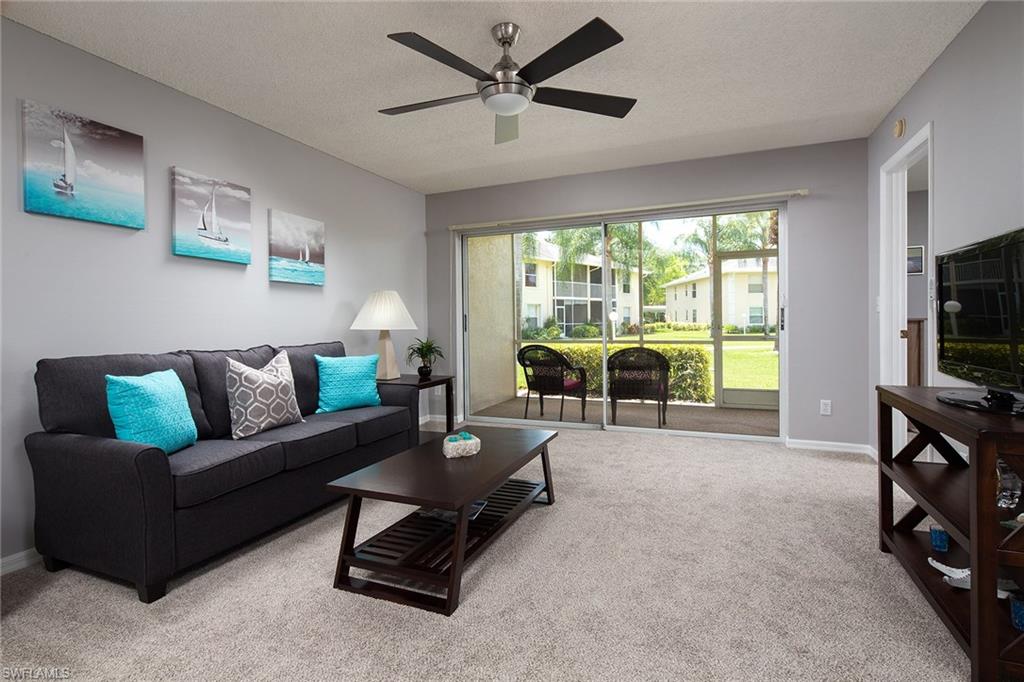This fully furnished, turnkey, first-floor condominium boasts brand-new modern furnishings and decor. Freshly painted throughout with soft grey colors and vibrant white trim, there is nice white tile in kitchen and bathrooms and new carpet in living room, dining room and bedrooms. Walk-in closet is in master. Many updates include all new light fixtures, ceiling fans, faucets and new water heater. Bright, open main living area flows out to the lanai with great views of mature palm trees, giving you a peaceful, tranquil feel. Enjoy yourself at the swimming pool or clubhouse just minutes away. Great location less than a mile to Berkshire Commons Plaza with Publix, Starbucks, and restaurants. Low HOA fees in a well-maintained community. Berkshire Lakes offers tennis courts, scenic paths around the lakes, convenience to I-75, 15 minutes to downtown Naples and beaches. This move-in ready condominium comes with everything you need, just bring your toothbrush and move right in!