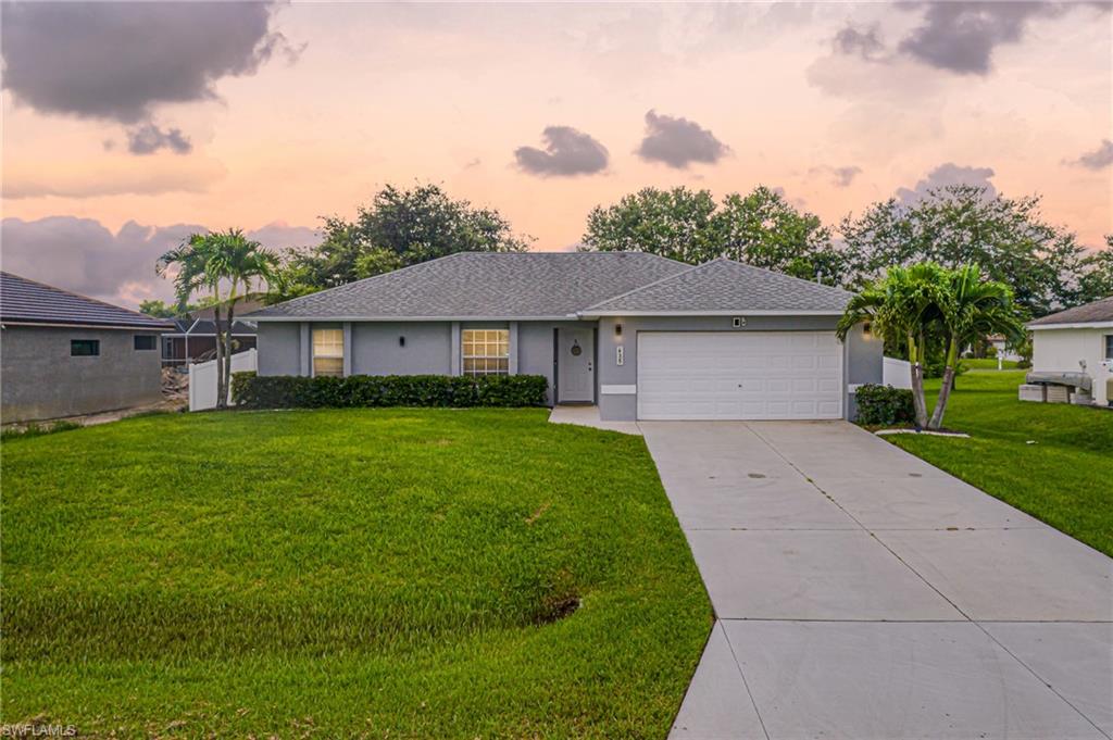 Welcome to your charming 3/2 fenced in Florida home located in the fast and growing city of Cape Coral. Just minutes from shopping, dinning and entertainment. This beautiful home boasts soaring ceilings in the main living area yet still cozy enough for family gatherings. Recently fenced in for privacy and the perfect backyard BBQ's. Kitchen was completely updated in 2016. Master Bath beautifully remodeled in 2020 with smart home technology. All windows are hurricane impact. Hot water heater replaced in 2016. Brand new exterior paint. Well water for irrigation. New smart home garage door opener - control from your phone. The list goes on. 
Make an appointment today you will not be disappointed by charming and cozy home.