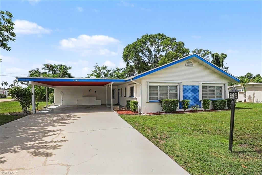 Great location close to shops and eateries! No HOA!  No CDD!  Spacious 3 bedroom, 2 bath home on a corner lot in the Villas.  NEVER FLOODED, NO FLOOD INSURANCE required.  Carport is 2 cars wide. (could be enclosed)  Home needs updates but has good bones.  Roof replaced in 2024.  HVAC in 2022.  Large living room and family rooms.  Good storage and closets throughout, including a shed in the back yard.  Irrigation is installed, but needs serviced. Laundry is in workshop off family room.   Lots of potential!