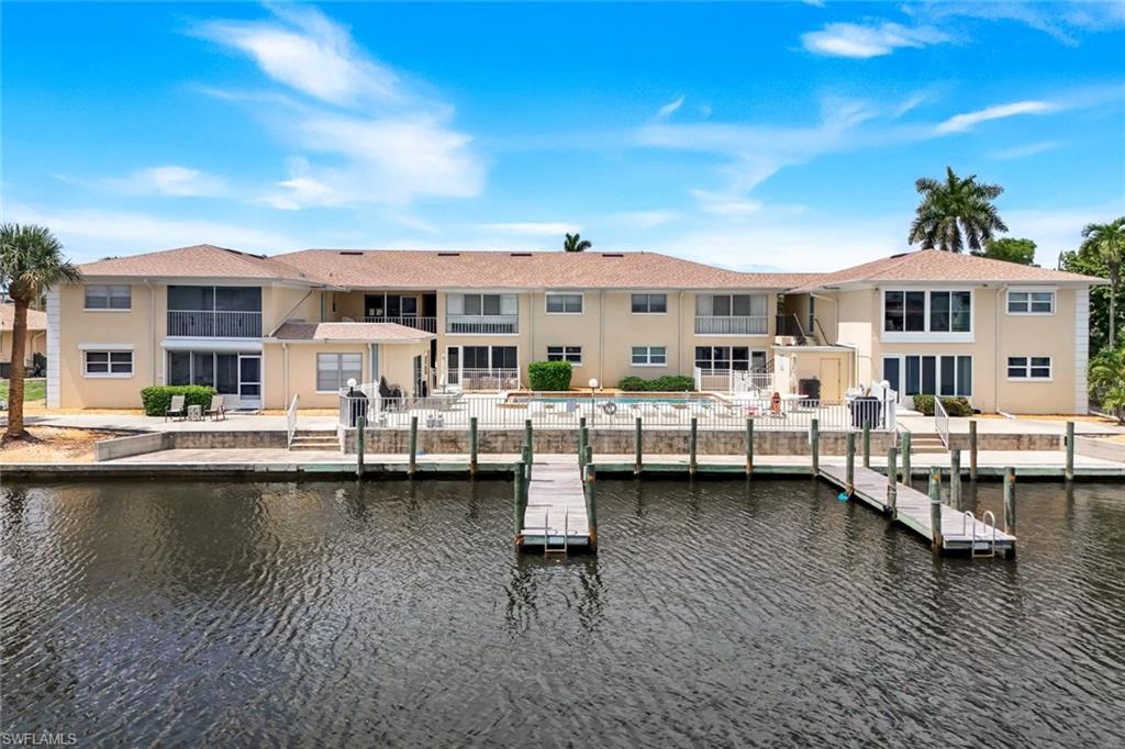 Location, Location! Experience the best of Southwest Florida waterfront living in this beautifully remodeled first-floor condo with a relaxed coastal vibe. Move-in ready and being sold turnkey, this waterfront gem is located in a desirable boating community offering direct Gulf access and your own boat slip just steps from your door.

Inside, you'll find a stunning renovated kitchen featuring stainless steel appliances, quartz countertops, recessed lighting, and a beautiful blue mosaic tile backsplash that perfectly complements the beach-inspired design. Plank TILE flooring flows throughout the residence, creating a seamless and low-maintenance living space. ***UPDATED all electric and plumbing in 2023; A/C replaced in 2025.  Short term rentals allowed: 3 per year, minimum of 30 days. Boat slips available for residence only- 1 boat per unit.

The open-concept living and dining area is designed for both comfort and entertaining, while large sliding glass doors fill the home with natural light and showcase breathtaking waterfront views. Relax from your living room or step outside to enjoy the peaceful beauty of the surrounding waterways.

Boaters will love the quick access to the Caloosahatchee River and open Gulf waters, making this an ideal location for fishing, cruising, and exploring Southwest Florida by boat.

Whether you're looking for a full-time residence, seasonal retreat, or investment opportunity, this exceptional waterfront condo offers the perfect blend of location, lifestyle, and value.
