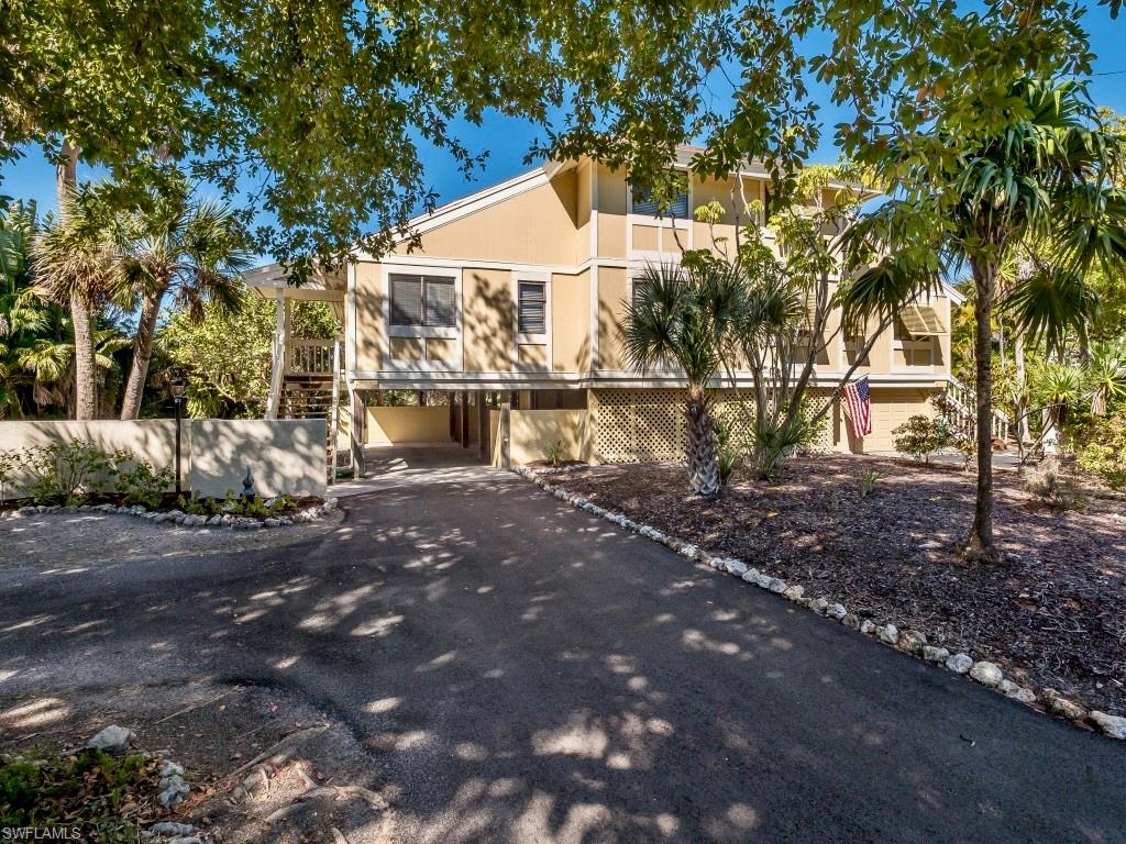 Charming 3 bedroom, 2 1/2 bath located on a quiet street in the Dunes.  Enter to cathedral ceilings in the bright open living & dining room, with sliding glass doors onto an enlarged fully screened lanai.   Enjoy a first-floor master suite with a den that opens onto the lanai.  The laundry is located off the kitchen and 2 guest bedrooms with full bath are found upstairs.  Under the house provides space for parking multiple vehicles as well as an enclosed storage area.  Located very close to the bay and within a short walk to the beach or four quick turns to the causeway making this an ideal location for your island home.