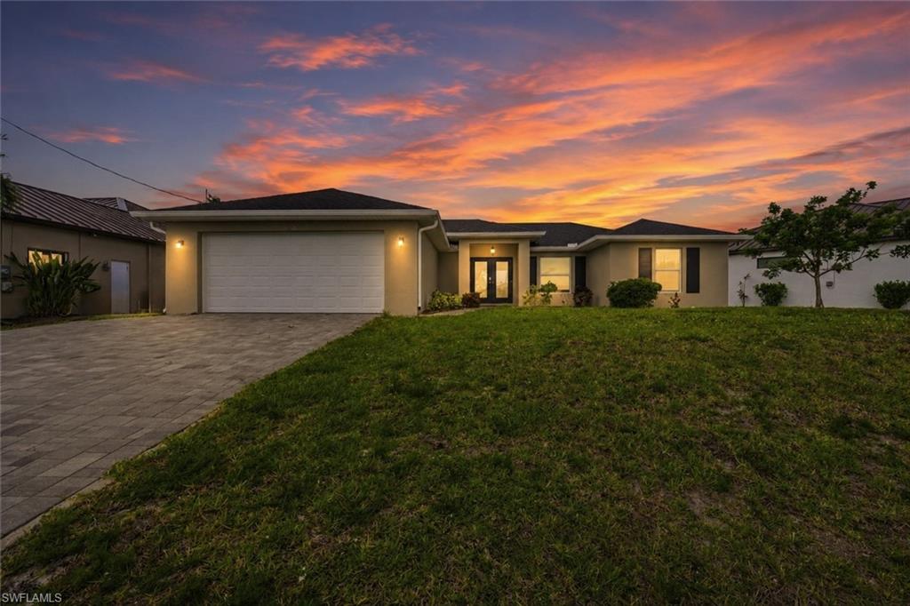 Welcome to Gulf access living in Northwest Cape Coral. Once a dock and lift are added, you could be enjoying lunch at the famous Cabbage Key in under an hour, exploring Pine Island in approximately 30 minutes, or spending the day cruising the waters surrounding Sanibel. Offered turnkey furnished, built in 2022, and situated on a south-facing lot, this 3-bedroom, 2-bath home offers bright and modern living with vaulted ceilings, tile flooring throughout, white cabinetry, stainless steel appliances, soft-close drawers, and an open concept layout filled with natural light. The spacious primary suite overlooks the water and also features dual vanities and a large walk-in shower with a rainfall showerhead, offering a spa-like feel right at home. An air-conditioned garage, set up as the ultimate hangout space, complete with a TV area and ping pong table, makes it the perfect game room, man cave, or entertaining space. Outside, you will find both a spacious front yard and backyard with plenty of room to add a pool, dock, and boat lift after closing, giving you the opportunity to create the waterfront lifestyle you have been dreaming about. Located just off Burnt Store Road, this home offers easy access to Pine Island Road, shopping, dining, and everyday conveniences. This is the full-time residence, seasonal getaway, or investment opportunity you have been looking for.