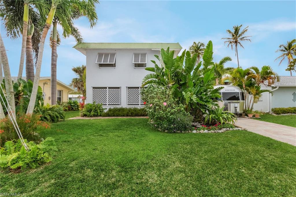 Are you searching for an updated Bokeelia waterfront home near Boca Grande Pass and the Gulf of Mexico?  Tarpon season is almost here!  Grab your gear and be in Tarpon Fishing Capital of the World within 15 minutes!  This lovely updated "Bokeelia Shell House" is move in ready with new tile floors, pavers around the back along the canal, and the huge screened in lanai downstairs!  Want you company to visit, but give them their privacy?  No worries, as this house has a private bedroom and bath downstairs, with fabulous views of the canal.  A few of the important updates include KEVLAR hurricane screens for all windows and sliders, new a/c in 2019, all new aluminum railing, and so much more.  Please see list attached to the MLS for a full list.  Make your appointment today!