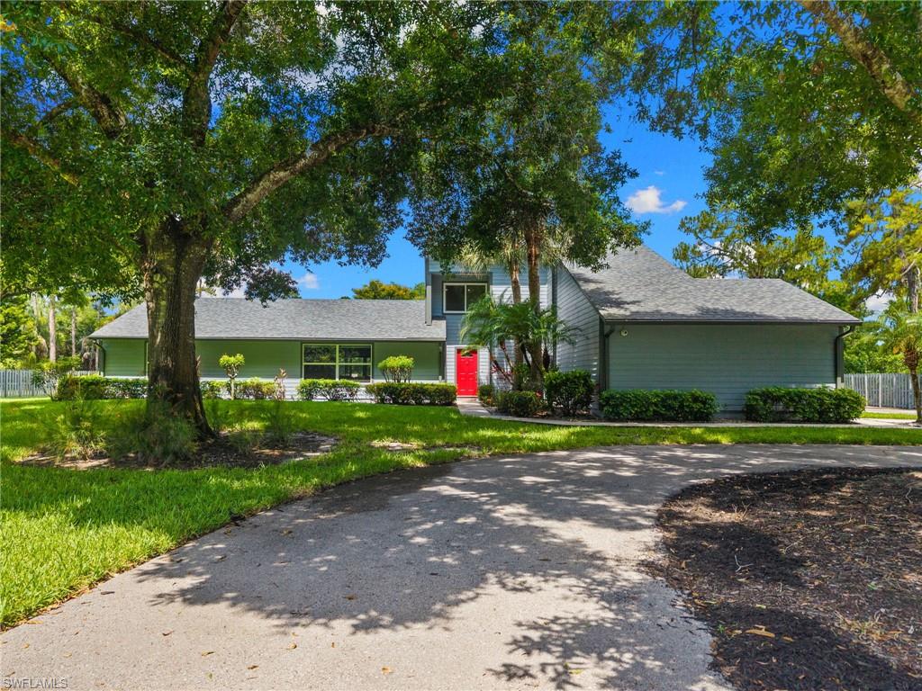 The ultimate collector’s estate in esteemed Collier Woods with NO HOA! Situated on a fully fenced 2.25-acre private oasis, this pristine property is an absolute dream for motor coach owners and automotive enthusiasts.The crown jewel is the elite vehicle infrastructure: a fully air-conditioned, 1,200 SF race car garage & workshop featuring RaceDeck flooring, a rapid air-line system, two Tesla EV chargers, and three newly installed high-capacity, industrial aluminum vehicle lifts to effortlessly house 6 cars. For luxury travel, the estate boasts a premier dual Motor Coach storage facility with massive 14’ access bays, 6” reinforced concrete pads, and a dedicated 300-amp transformer explicitly engineered for heavy-duty RV charging. An extra carport, covered utility shed, and an open workshop with ample shelving provide unlimited utility. Complementing this powerhouse setup is a beautifully renovated 3,539 SF main residence under air. It features brand-new roofs on all structures (2022), new high-end appliances including induction range (2023), dual master suites, and impact glass windows and sliders. The resort-style outdoor space includes a heated swimming pool with new marcite, a dedicated grill area, a whole-house reverse osmosis system, and generator—all secured by an electric entry gate and a comprehensive camera system. Just minutes from Naples’ world-class beaches, fine dining, high-end shopping, and I-75, this rare estate perfectly balances high-octane utility with luxury living.