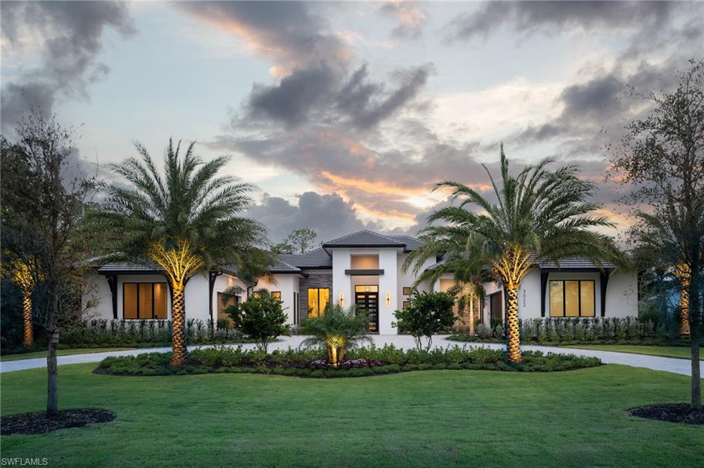 One or more photo(s) has been virtually staged, AI generated or rendered.  DESIGNER FURNISHED AND MOVE-IN READY HOME AVAILABLE NOW! Seagate Development Group and Theory Design present the professionally designed and furnished Liberty Custom Home in Silver Oak, one of Seagate’s newest, luxury communities in Naples. This custom home is a collaboration between Seagate Development Group and Theory Design with Architecture by RG Designs, and custom landscape & hardscape design by Outside Productions. Silver Oak, developed by Seagate Development Group, offers exclusive living on 10 expansive Estate homesites, each spanning 1.25 acres. With no homeowner's association, residents have the freedom to customize their homes and enjoy a superior standard of living. Enjoy a modern design with clean lines and contrasting natural woods with European White Oak floors throughout and lit reverse soffit ceiling details. The Liberty model features four bedrooms, a study, four full and two half baths, and a dual two-car garage. The spacious outdoor living area is accentuated with a fire pit, oversized pool with bubbler and spa, and plenty of yard space. The outdoor living area also features a screen enclosure, tongue and groove stained ceiling, outdoor kitchen, stone see thru fireplace, pool bath and lush landscaping. The gourmet kitchen includes two tone stacked cabinetry, with lit glass cabinets, backsplash, island with waterfall countertop, Sub Zero/Wolf appliance package, and windows providing plenty of natural lighting. The dining area includes a temperature-controlled wine room. The home also has a spacious bar with undercounter refrigerator and an ice maker. The master suite features a sitting area with glass door leading to the covered lanai. The master bathroom features marble floors and comes equipped with Kohler plumbing fixtures including 2 private water closets, dual vanities, soaking tub and an oversized shower with 4 showerheads. Additional luxury features include 9.45” European White Oak wood floor throughout, custom built-in closets, 1 ¾” solid interior doors, Emtek door hardware, linear HVAC diffusers in common areas, level 5 drywall, double pane Andersen impact windows & doors, Control4 home automation system, sound system, spray foam insulation, custom iron front door, natural gas, lush landscaping, and interior designer selected custom light fixtures and furnishings.
