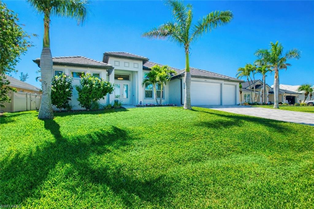 Beautiful Gulf-Access pool home with western rear exposure, ideally located near Cape Harbour in one of Southwest Cape Coral’s most sought-after neighborhoods. Set on a quiet, palm-lined street, this property offers the perfect blend of Florida lifestyle. The home features three bedrooms plus a den and three full bathrooms, laid out in an open-concept, split floor plan for privacy and easy living. French-pattern marble floors run throughout the home, complemented by plantation shutters in all bedrooms and the den. The modern kitchen is designed for both everyday use and entertaining, featuring a large center island, stainless steel appliances, and seamless flow into the main living area. A zero-corner sliding glass door opens fully to the lanai, creating true indoor-outdoor living. The primary suite offers a spacious retreat with dual sinks and a large walk-in shower with rain head. Outside, enjoy the expansive paved pool deck, heated pool and spa, and stunning canal views with western exposure for unforgettable sunsets. The Gulf-access canal includes a boat dock with kayak lounge, making this an ideal home for boating enthusiasts. Perfect as a primary residence, vacation rental, or seasonal retreat, this property delivers location, lifestyle, and versatility in one exceptional package.