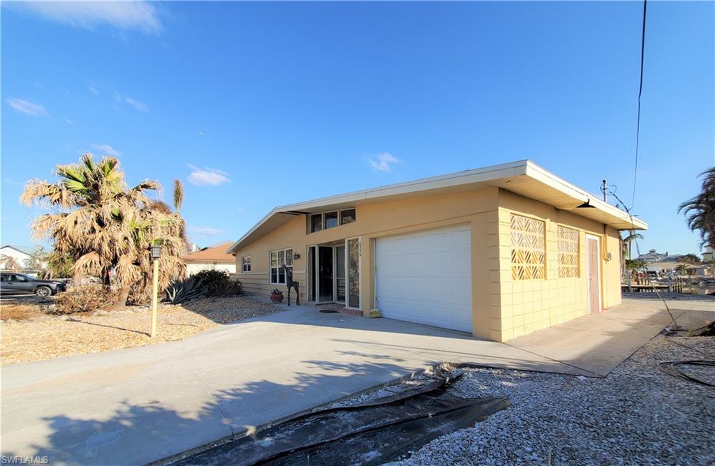 Bring your design and renovation ideas to life in this Laguna Shores home. The neighborhood of Laguna Shores, located at the south end of Fort Myers Beach has always been a beautiful and highly desirable location. Bring your creative ideas to this long water view home and enjoy the fishing, beaches & local flavors of our cherished island. Damages created by the recent storm of Sept 28th to this home as well as the relaxed and beautiful island will fade as we rebuild the quaint & charming island of Fort Myers Beach. This Expansive parcel... Southwest facing location with nearly the entire parcel being on the most desirable canal location. At 8336 Lagoon Road... Your vision of a Florida Lifestyle can come true.