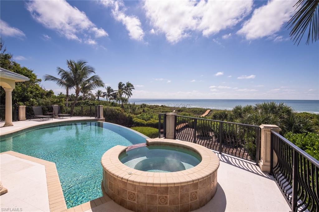 This distinguished beachfront property provides some of the most captivating views in all of Sanibel. Words can not describe the sense of awe and comfort when entering this home and seeing the style and view of the ocean. This stylish beachfront home was custom built in 2007 and exquisitely remodeled in 2019 by an award-winning Miami designer. The home flows with 5,900 sq. ft. of interior space, a great room design, 4 bedrooms, a den, amazing views of the Gulf of Mexico, and a seamless sense of openness with light-filled rooms and magnificent covered terraces. Enjoy the tranquility and peace from the elevated main level lux-bright saltwater infinity pool and spa. The spacious kitchen was designed for entertaining, features custom cabinetry, a large island, and top name appliances. A combination of marble, travertine, carpeting, and wood flooring throughout warms the spaces, while large picturesque windows and doors enhance the views. Additional highlights include handcrafted Venetian glass chandeliers in great room, magazine landscaping & lighting, an elevator, built-in spa, 2 – gas fireplaces, extensive storage, a 3+ car garage, and a composite boardwalk to the beach.