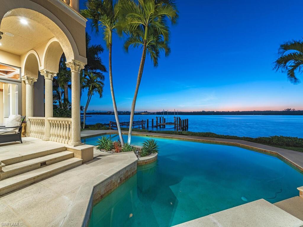 H10948 - Perched along the dynamic Naples Bay shoreline, 7,948 sq ft of living space represents a timeless architectural design penned by renowned Randy Stofft of Stofft Cooney Architects. Residence is also eligible for Primary Membership to the prestigious Port Royal Club.