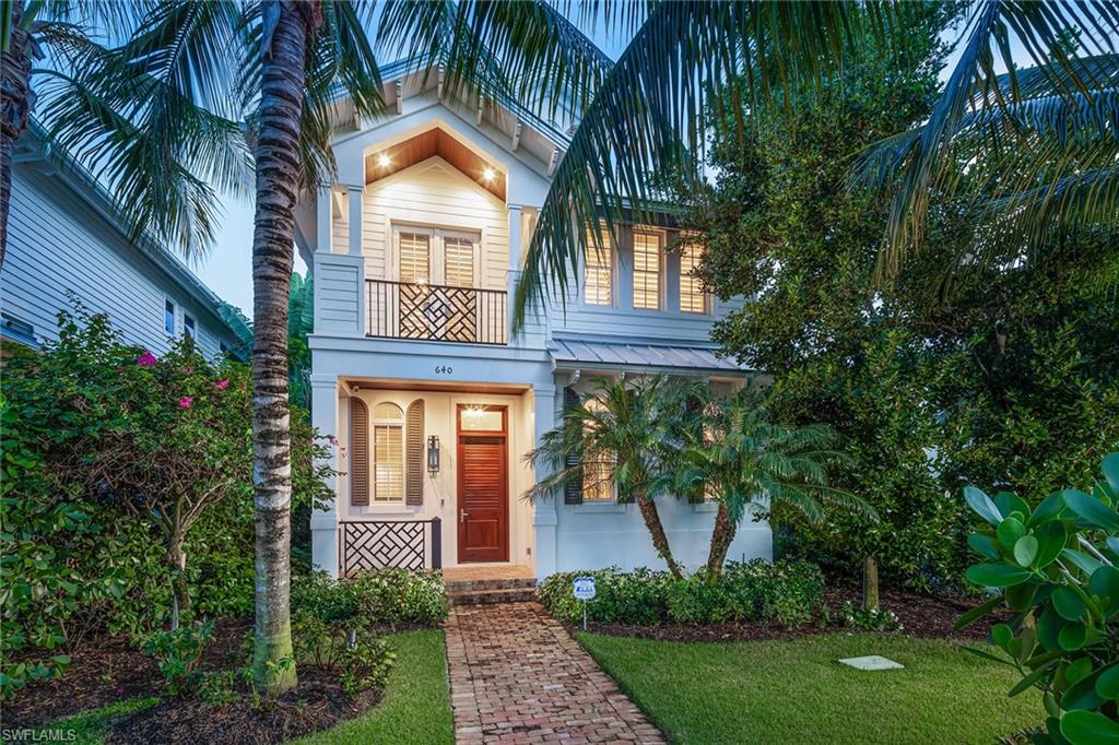 Quintessential coastal cottage in downtown Naples located a very short distance from Fifth Avenue South for shopping, dining and entertainment and only six blocks from the beach. Fabulous two-story single-family home with great room floor plan, featuring four bedrooms and three-and-a-half baths. Open kitchen with quartz countertops, gas Wolf range and Sub-Zero refrigerator, plus breakfast bar, large dining and living space. Adjacent powder room and walk-in pantry plus an elevator. Ten-foot sliding glass doors lead to a covered/screened outdoor living area with a built-in grill overlooking the pool and spa with a water feature, privacy wall and lush landscaping. Second floor features gorgeous primary suite with a large bath and two walk-in closets, and three guest bedrooms with two full baths. Two-car garage located at the rear with alley access. Offered fully furnished — designer details, lighting and furnishings just complete September 2021.