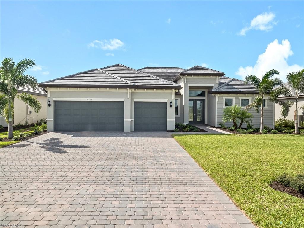 Brand new just completed!! Gorgeous move-in ready lake view home without the 7 month wait. The beautiful flagship Sunset Model is one of the most desirable floor plans available. Boasting 2,650 sq ft under air, 3 bedrooms, 3 full baths, den, 3-car garage, an open floor plan with split bedrooms and on an expansive lake view lot. This home is located in the resort lifestyle community of The Place at Corkscrew with an abundance of amenities. The Place amenities include a resort-style pool with a 100' waterslide, two waterfalls, a 40-person spa, beach cabanas, pool side food and beverage service, 2-story state-of-the-art fitness center overlooking the pool, café and market place, indoor outdoor restaurant, adult only Bourbon Lounge, sand volleyball, pickle ball, tennis, basketball, playground, dog park, and so much more.  Close to Ft Myers Intl Airport, FGCU, SWFL Beaches, shopping, dining, entertainment and so much. What are you waiting for? Come and live where others vacation!! #BecasueYouDeserveIt
