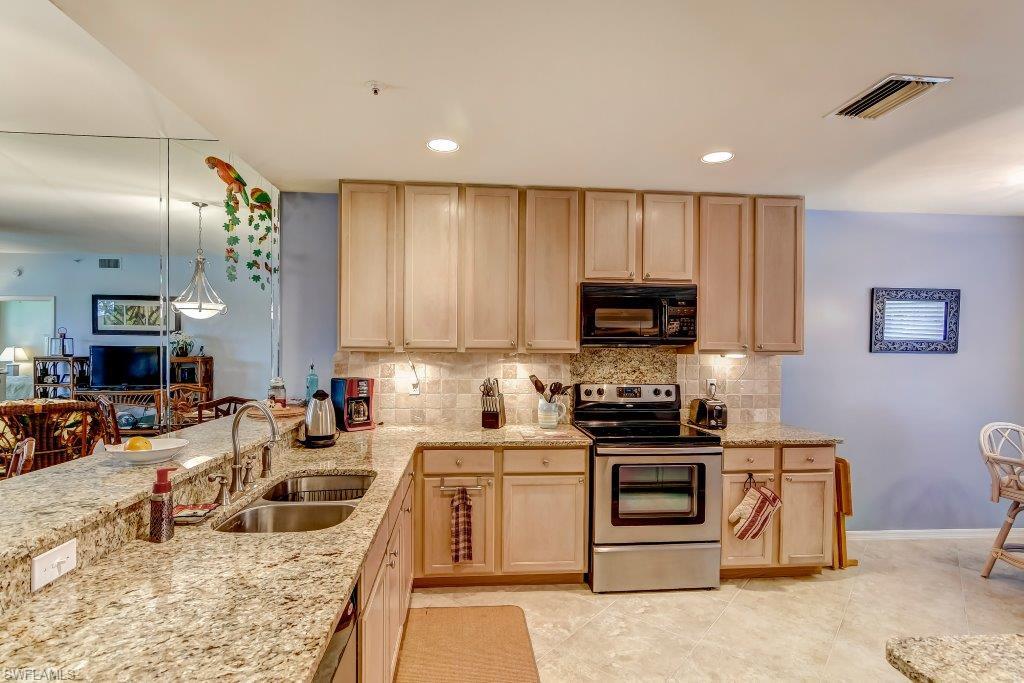 Stunning views from this tastefully furnished condominium in one of Naples most coveted gated country club addresses located just minutes to downtown. The amenities in Windstar are second to none. The community features a Tom Fazio Championship golf course, beautiful new clubhouse with state-of-the-art fitness center, 6 tennis courts, casual and fine dining, a members' bar overlooking Naples Bay with spectacular sunsets and a private boast launch to take you to your private beach getaway at Keewaydin Island. The 72-slip world-class deep water marina is a real perk for boating enthusiasts. This immaculate home exudes a true Florida lifestyle, with tropical décor and lots of light. Call today for details on how this spacious 2 bedroom, 2 bath Naples gem can be yours!