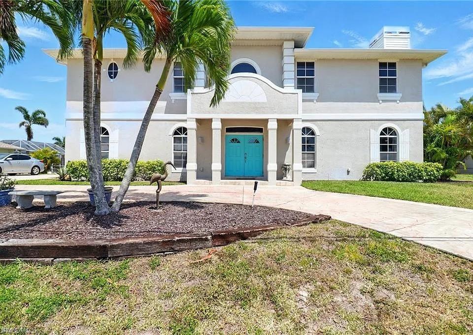 **RARE GULF WATERFRONT TRIPLE-LOT ESTATE... Priced to Sell!** Commanding a rare 120x125 triple-lot footprint in SW Cape Coral, this estate offers unparalleled privacy, a grand circular driveway, and an expansive presence with a NEW Roof (2021). No HOA. Not in a Flood Zone (no flooding history/never needed flood insurance). Water/sewer in. **THE WATERFRONT LIFE** * 120+ ft concrete seawall & private patio dock with direct Gulf access. **THE RESIDENCE** * **Layout:** Masterfully designed 2,386 sq ft open-concept with soaring ceilings, crown molding, & high baseboards on the 1st floor. Includes 4 beds, private executive loft office, 2nd living area, & 2.5 baths. * **Smart Design:** No bedrooms on 1st level; downstairs is a dedicated hosting haven. All bedrooms tucked upstairs for privacy with a split setup. * **Indoor/Outdoor Flow:** 3 sets of 8' disappearing pocket sliders open to a massive, large screened lanai with a beautiful view of water. Also includes irrigation system. * **Windows & Parking and more:** Impact glass on 2nd floor. Oversized 2.5-car garage. Wood burning fireplace. Prewired surround sound, outlets on soffit for holiday lights, crown molding, high baseboards * **Upgrades:** Fresh exterior paint (2022); fresh interior paint (2024/2025). 4 outdoor spigots. **CHEF’S KITCHEN** * Granite counters, center island with vegetable sink, and 2 eat-in bars. Abundant cabinets and drawers. * Dual oven, dual main sink, appliance garage, hidden trash/recycle, & 2 large top/bottom pantries. * Dedicated coffee bar & new fridge with custom panels & beverage center (2024). * New appliances: (2023) microwave, (2024) refrigerator. **UPSTAIRS RETREAT & BATHS** * Brand-new flooring upstairs (2024). * 2 bedrooms feature custom built-in lofts with integrated storage. * Both showers fully remodeled with high-end modern tile and finishes. All bathrooms have granite countertops. * Primary suite features dual vanity with dedicated glam station and Jacuzzi soaker tub. Secondary bath has a brand-new bathtub. **BACKYARD OASIS & POOL** * Unique-shaped heated saltwater pool with waterfall and tanning ledge with fountain. * **Equipment:** New pool pump (2024), generator and timer (2021). * **Safety & Access:** Equipped with a Baby Barrier Gate and dual access doors and water spigot located in pool area. * **Spa Ready:** Entire pool area is pre-wired for a future spa. **MECHANICAL & LOCATION PERKS Roof: New roof installed in 2021. Power Backup: Full-home generator transfer connection with an in-home generator switch. Impact glass on 2nd floor. Location: Prime SW Cape Coral location near shops, dining, schools, and best waterways.