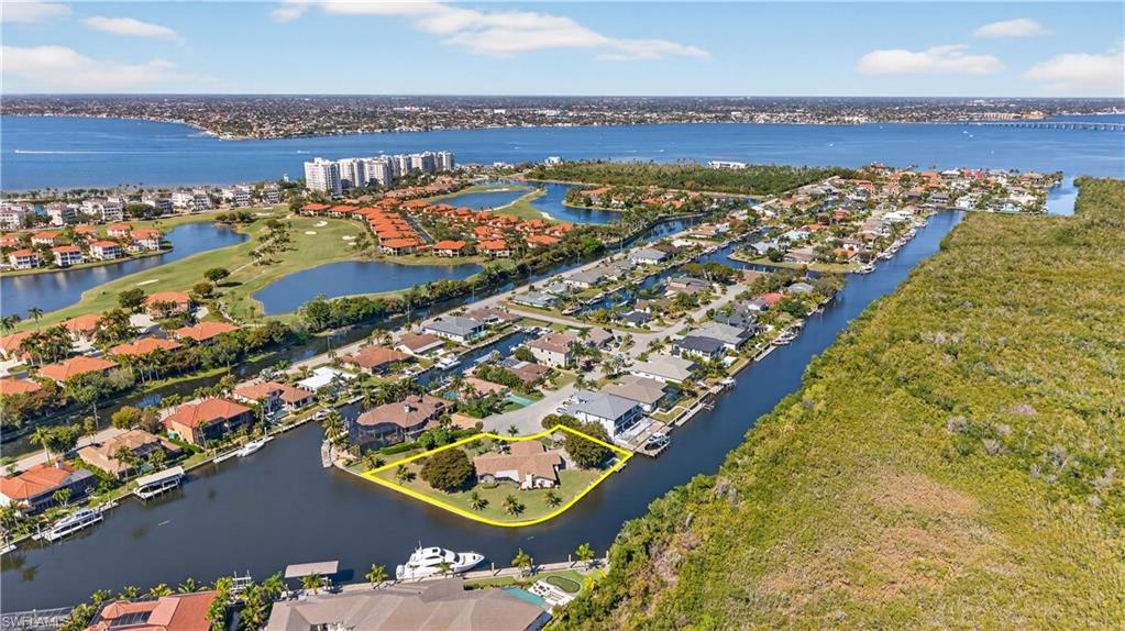 Expansive. Flexible. Waterfront.

Set on a rare DOUBLE-waterfront homesite in Palmetto Point, this 0.73-acre offering delivers something almost never seen in Southwest Florida—true optionality. Keep and enjoy the fully renovated 3,972 sq. ft. residence, design and build a custom estate to match the setting, or explore the potential to subdivide into two waterfront homesites. A property that lives as a home today and performs as an investment tomorrow.

The existing residence is far from a placeholder. Thoughtfully renovated with high-end finishes throughout, it offers 4 bedrooms plus a den, 3.5 baths, an oversized 2-car garage with additional storage rooms, a large laundry room, game room, fireplace, screened lanai, with a built-in grill. The layout is designed for real living—comfortable, functional, and ready to enjoy while you plan what’s next. Recently planted trees further enhance the grounds, adding privacy and long-term value.

For boaters, this is where the property separates itself. Approximately 250 feet of wide, deep-water, direct-access frontage is already improved with a dock and seawall, complemented by an adjacent basin that makes maneuvering effortless. In total, nearly 400 feet of seawall creates a presence that feels more like a private marina—offering the flexibility to accommodate larger vessels, including boats up to 100 feet.

Positioned in one of Fort Myers’ premier boating communities, Palmetto Point is defined by its direct Gulf access, wide canals, and surrounding multi-million-dollar homes. From your dock, you’re just minutes to the river and a short run to the Gulf, with easy access to Fort Myers Beach, Sanibel, and Captiva.

And for added peace of mind: this property has never flooded.

One property. Multiple paths. A rare chance to own scale, flexibility, and true deep-water access in a location that continues to define Southwest Florida waterfront living.
