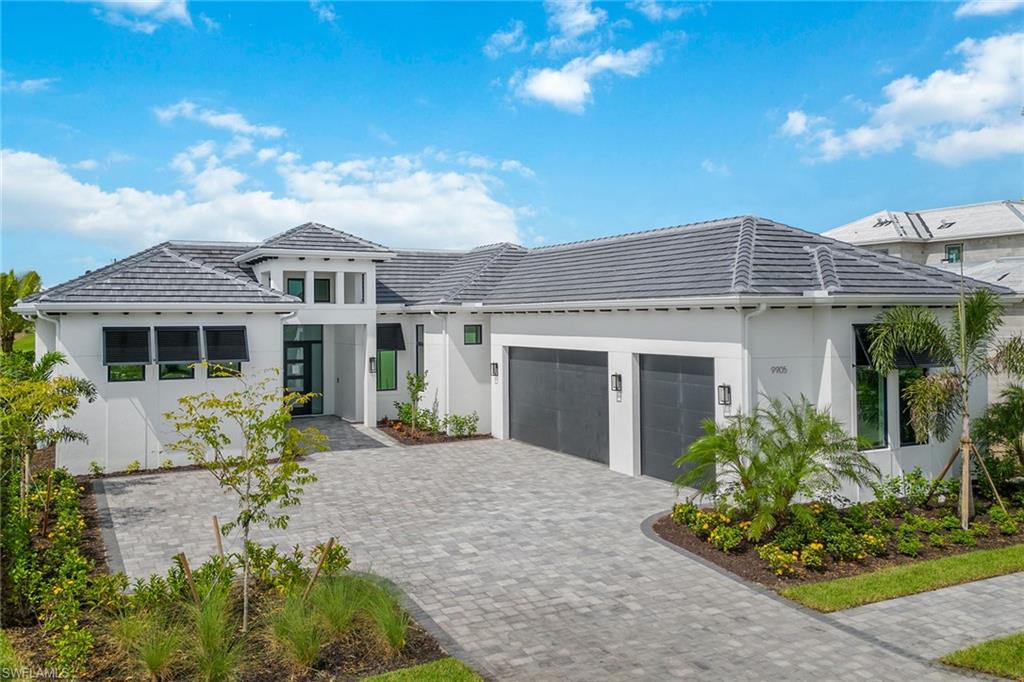 Only new home available at Peninsula! Completed June 2023. Custom built by Imperial Homes Of Naples LLC, this highly upgraded Burano features 3,660 square feet, with 5,137 square feet total, including four bedrooms with one designed to be used as a den, 4.5 baths, great room, spacious kitchen with island, Sub-Zero, Wolf and Kohler amenities, natural gas, walk-in pantry, wood flooring throughout, outdoor kitchen, custom pool and spa, picture frame pool enclosure, electric roll-down hurricane screens, three-car garage and the highest level of specifications, see supplements. Located in Peninsula at Treviso Bay, a gated enclave of 54 lakefront homesites surrounded by views of the breathtaking TPC Treviso Bay golf course, lake and preserve. This home has been customized with Control4 automation and a host of optional features too numerous to list, see supplements. The distinctive floor plan boasts an open concept that flows seamlessly, blending outdoor and indoor living spaces emphasizing the amazing views. Twenty-four feet of glass doors tuck away into the adjacent walls. Full golf membership is included! Photography is of actual unfurnished home and is virtually staged.