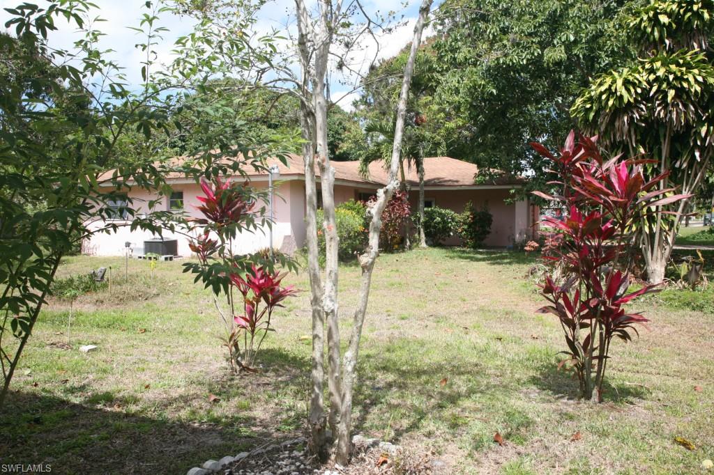 H.8165 - Looking for a good deal?  This charming 3 bedroom 2 bath home is an ideal home for anyone who likes peace and privacy.   It is located in a quiet neighborhood but only 3 miles from the River District, downtown Ft. Myers.  The CBS home offers a spacious open-floor plan, L shape dining and living room, comfortable kitchen, big screen lanai, 2 car garage, large yard with many fruit trees and no social fees.  Can benefit from updating but has a great potential.  Listed at appraised value and won't last long.