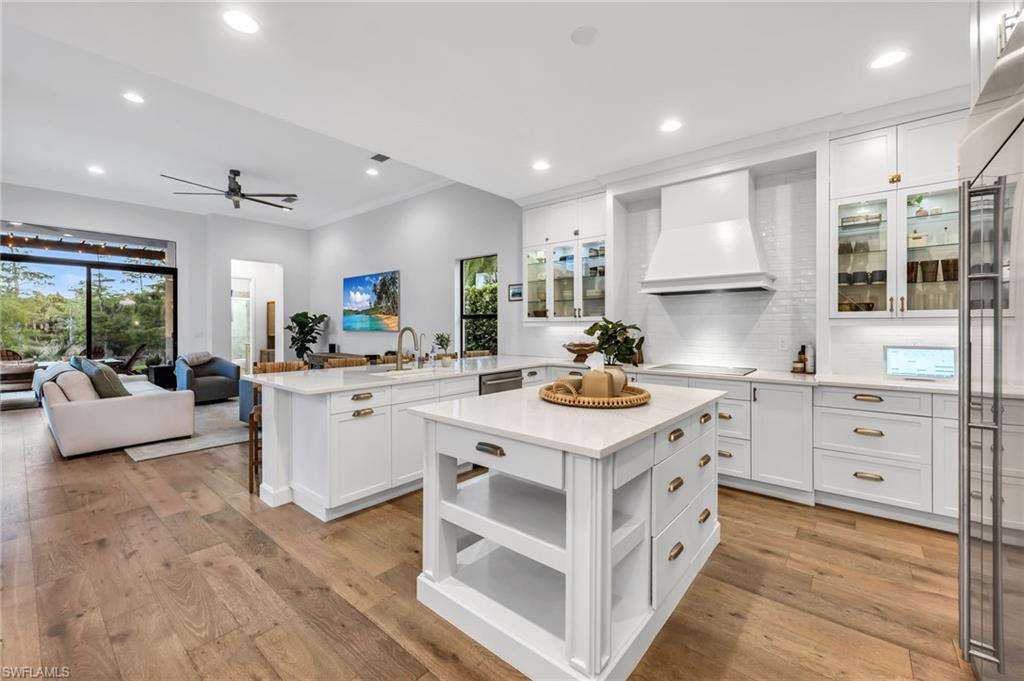 Experience one of the most impressive homes available in Riverstone, offering the community's largest and most sought-after floor plan. This exceptional Dubonnet Grande combines luxury, comfort, and functionality, with extensive custom upgrades throughout and the rare opportunity to purchase the home fully furnished with designer pieces from Restoration Hardware and Pottery Barn. From the moment you enter, you're welcomed by soaring ceilings, an elegant foyer, and an abundance of natural light that fills the home through expansive windows overlooking the private outdoor living space. Thoughtfully redesigned with impeccable attention to detail, every room showcases quality craftsmanship and timeless style. The heart of the home is a stunning chef's kitchen featuring custom cabinetry, premium GE Monogram appliances, quartz countertops, glass-front display cabinets, and a spacious center island perfect for entertaining. The beautifully customized pantry offers both style and practicality with glass French doors, butcher block countertops, subway tile accents, and built-in shelving designed to maximize storage. The main living areas feature durable engineered hardwood flooring, while the upgraded laundry and mudroom provide custom cabinetry, additional storage, and everyday convenience. The first-floor owner's suite serves as a private retreat, complete with bay windows overlooking the backyard and a spa-inspired bathroom that has been beautifully renovated for ultimate relaxation. Step outside and discover your own private resort. The backyard is framed by lush Clusia hedges and preserve views, creating a peaceful and secluded setting. Western exposure provides breathtaking sunset views, while the custom pool and spa feature a sun shelf, elegant spillover spa, and shell-stone pavers that remain cool underfoot. Additional outdoor enhancements include a newly screened balcony lanai with a gym setup, an outdoor sauna, a playground set, and a removable safety fence around the pool, perfect for families seeking both luxury and peace of mind. Upstairs, a grand staircase leads to a spacious loft area, a versatile bonus/media room with custom built-ins and a mini refrigerator, three additional bedrooms, and two-and-a-half bathrooms. Additional premium upgrades include three independent HVAC systems for personalized comfort, a mini-split air conditioning system in the garage, crown molding throughout much of the home, a 50-amp generator hookup, and a 240-volt outlet ready for electric vehicle charging.
Offering an unmatched combination of luxury, space, and lifestyle amenities, this move-in-ready residence delivers everything today's buyers are looking for; all within one of Naples' most desirable resort-style communities.