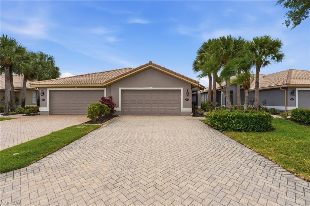 Welcome to 20038 Serre Drive in the highly sought-after Bella Terra community in Estero, Florida. Ideally located on a low-traffic cul-de-sac near the front of the community, this move-in-ready attached villa is just steps from the resort-style amenities and main entrance gate, offering both convenience and an exceptional lifestyle.

This spacious open-concept villa features 2 bedrooms, 2 bathrooms and has been thoughtfully updated and meticulously maintained throughout.

A comfortable and inviting living room situated just beyond the entry foyer flows seamlessly into the heart of the home — a beautifully appointed kitchen featuring white shaker cabinetry, upgraded granite countertops, stainless steel appliances (approximately three years old), a stainless steel sink, and a spacious pantry. Adjacent to the kitchen is a spacious dining area that flows seamlessly into a convertible bonus area ideal for an additional living room or den.

Sliding glass doors open to the screened lanai overlooking lush landscaping and partial lake views. This peaceful outdoor space is perfect for enjoying your morning coffee or relaxing at the end of the day.

Privately located at the rear of the villa, the inviting primary suite features a walk-in closet, linen closet, dual vanities, and a walk-in shower. The guest bedroom and bathroom are located on the opposite side of the home, offering comfort and privacy for visitors.

Additional features include an inside laundry room, spacious two-car garage, waterproof luxury vinyl plank flooring throughout the main living areas, ceramic tile in the primary bath, recently painted guest bedroom and bathroom, and a new 40-gallon water heater installed in 2023.

Outside, enjoy an attractive paver driveway with additional parking and a long screened entryway leading to the front door. The exterior was freshly painted in March, and the HOA maintains the landscaping, roof, and exterior painting for low-maintenance living.

Bella Terra spans 999 acres with over 400 acres of preserve and 100 acres of lakes. Residents enjoy a 24-hour fitness center, tennis, pickleball, bocce, basketball, volleyball, soccer field, playground, butterfly garden, inline skate rink, scenic walking trails, and more. A resort-style pool with spa and waterfall, along with an additional ancillary community pool, provides year-round enjoyment.

The community also offers an active social calendar including food truck nights, bingo, poker, and water aerobics.

Conveniently located near RSW International Airport with easy access to I-75, Bella Terra is close to FGCU, Miromar Outlets, Coconut Point, Gulf Coast Town Center, Hertz Arena, and some of Southwest Florida’s best dining and shopping.

Whether you are searching for a full-time residence or seasonal retreat, this move-in-ready villa offers exceptional value, comfort, and lifestyle in one of Estero’s most desirable communities