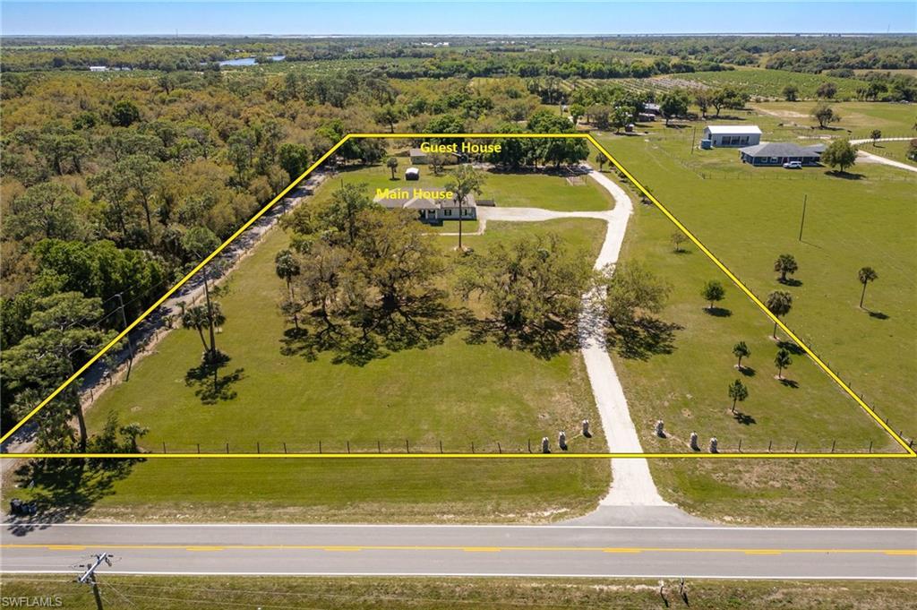 Two homes on 5.75± acres in the historic Fort Denaud area—perfect for multigenerational living, a family compound, or anyone needing space, privacy, and flexibility.

The main home offers 3,070 sq ft under air with five bedrooms, three full baths, and a half bath. Cathedral ceilings and polished concrete floors create a bright, open feel, while level 4 granite adds an upscale touch. Built with 8-inch concrete exterior walls, low-maintenance materials, and thoughtful design, this home is made to last.

Highlights include: • Open kitchen with abundant storage, dovetail soft-close cabinetry, recessed lighting, and a brand-new stove
• Walk-in closets in every bedroom
• Master suite with private office or nursery
• Entire room dedicated to extra storage
• 400-amp electric service and oversized septic sized for two additional bedrooms and baths
• Impact windows and doors
• Energy-efficient reflective roof plywood and enhanced attic insulation

At the southern end of the property sits the 1,620 sq ft guest house at 1301 Jacks Ln, offering three bedrooms, two baths, and numerous updates: new HVAC with ductwork, fresh exterior paint, updated plumbing and lighting, new gutters, and added attic insulation. Ideal for extended family, guests, or rental income.

The 5.75± acre parcel is zoned for horses and livestock, giving you the freedom to enjoy true country living while still being close to town. A rare opportunity to own a versatile, move-in-ready compound with room to grow.