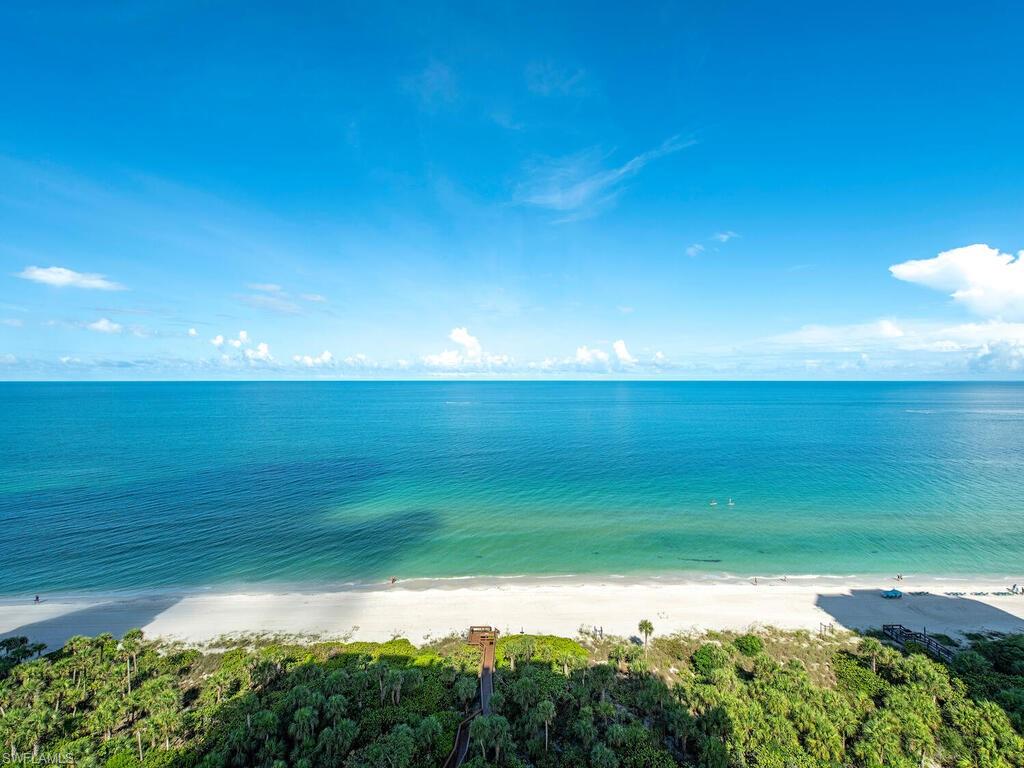 C2896 - Direct Gulf Front Three bedroom Three and One Half Bath Residence with direct western exposure. Enjoy breath taking gulf views through Hurricane Impact Glass in  the family room as you watch dolphins play and the beautiful  sandy beaches. Spacious floor plan offer three bedrooms plus three and one half baths. Each bedroom has a private bathroom. Residence features white floors and was recently repainted in a light coastal color. Electric storm shutters protect your amazing 16th floor residence. At 3,200 sq. ft. of living area you will have plenty of  room to roam. The Biltmore social areas have been completely remodeled and include 2 guest suites as well as a very large social room and health club.. Front Desk in manned 24/7 365 .  Enjoy the Bay Colony Lifestyle and your own private beach club behind the gates. Extra storage plus two deeded parking spaces.