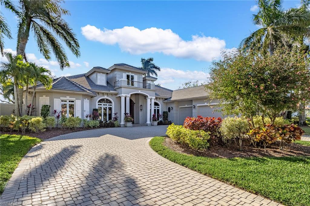 This stunning remodel brings contemporary elegance with luxurious comfort, offering an exceptional living experience indoors and outdoors. The home’s striking exterior features expansive glass windows framing wide, sweeping views of Kensington’s 2nd and 3rd golf course holes. The large lanai, which serves as an extension of the living space is perfect for entertaining or relaxing while taking in the views of the course. Southwest exposure provides wonderful sunsets. The huge lanai is ideal for outdoor dining, lounging, or entertaining. It features a resort-like pool and spa and an outdoor kitchen. Inside, the living area boasts soaring ceilings and an abundance of natural light. The chef-inspired kitchen features high-end appliances, custom cabinetry and an expansive island. The living area flows seamlessly to the lanai through sliding glass doors, allowing for easy access to the outdoor oasis. The formal dining room easily seats 10 plus there is a breakfast area and large breakfast bar for casual dining. A butler’s pantry/bar area is conveniently located for entertaining. The owner’s suite is an expansive retreat with large windows providing a tranquil view of the course. The spa-like en-suite bathroom has a freestanding tub, walk-in shower, and dual vanities. Additional bedrooms offer plenty of room, high-end finishes, ample closet space and thoughtfully designed details.  All this as well as the ability to purchase a full golf membership to Kensington Golf and Country Club.