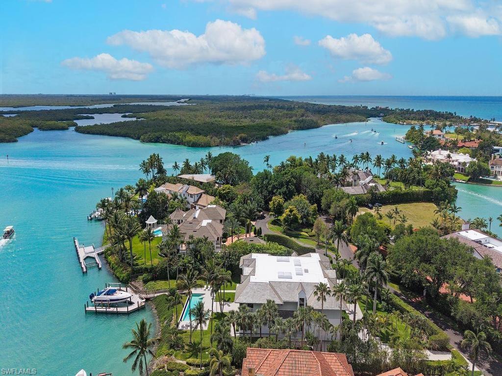An exceptionally rare lot and one-half with one of the most spectacular panoramic views in all of Port Royal.
this exceptional waterfront estate offers 147 feet along one of the area’s deepest yacht basins, on no-wake waterfront with bay views —ideal for serious boating enthusiasts. The residence features 5 spacious bedrooms, each with its own ensuite bath, along with two additional half baths for guests. Designed for both comfort and entertaining, the home includes a private study, a dedicated media room, and expansive living spaces filled with natural light. Car collectors will appreciate the four-bay garage, thoughtfully designed with lift capabilities to maximize capacity. Owners are eligible for membership to the exclusive Port Royal Club and Cutlass Cove Beach Club, offering access to one of Naples’ most private beachfront experiences. This is a unique opportunity to own a premier property combining scale, location, and deep-water access in one of Naples’ most sought-after communities.