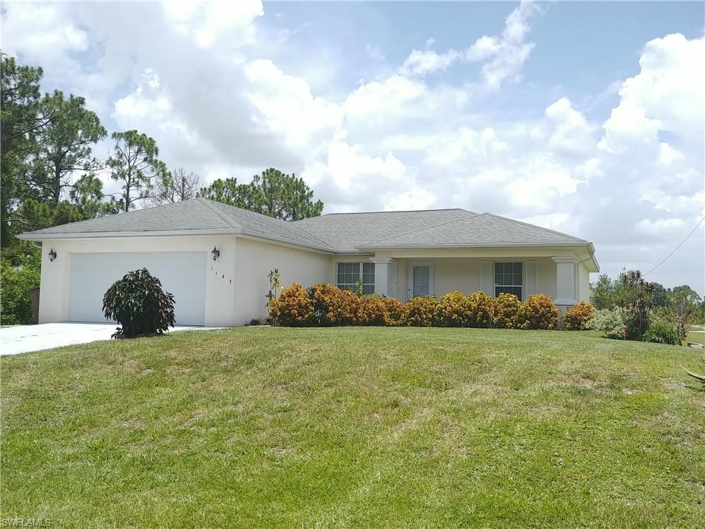 This popular floorplan features an island kitchen with brand new stainless steel appliances, pantry, new luxury vinyl flooring, new a/c, inside laundry, vaulted ceilings, split bedrooms, and a screened lanai.  Large corner lot in a quiet area.  Freshly painted throughout and ready for a new family!