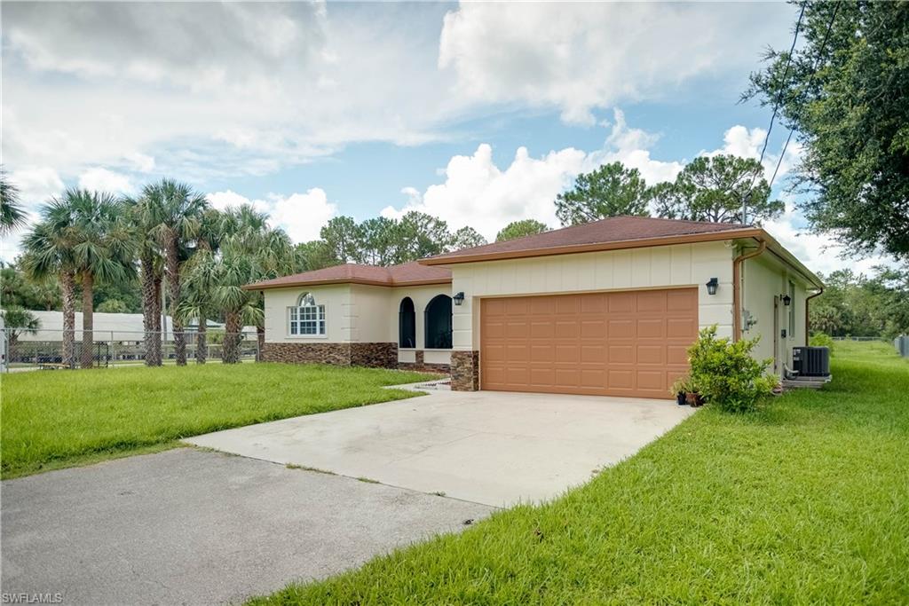 Beautiful home in the heart of Golden Gate Estates! Minutes to the new Publix, close to shopping center, Walgreens, hospital and library.  Best part is, that this home is unique.  It has access on 18th AVE NE as well as through Jung Blvd.  If you own a boat or an RV and would like access to the back of the home without a high price tag, then look no further... This is your home!  Home features, 3 bedrooms, 2 bath, double car garage, a nook and a beautiful kitchen with wood cabinets, stainless steel appliances and granite counter-top.  Family room has plenty of space to relax after a hard day of work or can be converted to a den.  Home is tiled throughout, brand new A/C and second bathroom has been completely updated and best of all home is completely fenced all the way to the back of the property.  Another unique feature is the enclosed screened porch so you can enjoy a cup of joe in the mornings!  Don't wait.  Schedule your showings today.  Before this beauty is gone, gone, gone!!!