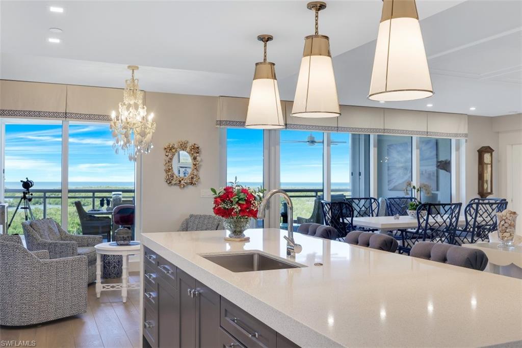 Available immediately! Truly exceptional, 4 bed 4 bath unit in the award winning Kalea Bay, tower 100. This open floor unit offers beautiful wide plank oak flooring in all living areas. Designer kitchen cabinets with quartz countertops and waterfall island perfect for entertaining. Gourmet kitchen features Sub Zero/Wolf appliances. A butlers pantry that includes a sub Zero wine cooler. Professional interior design and furnishings  as well as custom draperies give this unit a perfect coastal-chic feel. Incredible custom carpentry work featuring coffered ceilings and shiplap accents throughout this unit. Additionally this unit is protected by storm shutters and by interior sunshades for the sunny Naples weather. From your lanai you enjoy spectacular views of the white sandy beaches of Wiggin’s Pass and the stunning sunsets of the Gulf of Mexico. Relax in the heated spa pool on the rooftop or enjoy the views and the ocean breeze while working out in the rooftop gym. This beautifully appointed and meticulously maintained condo is being offered turnkey. Kalea Bay offers world class amenities, 24-hr manned gate, numerous dining options both indoor and pool side. Kalea Bay is Pet Friendly!