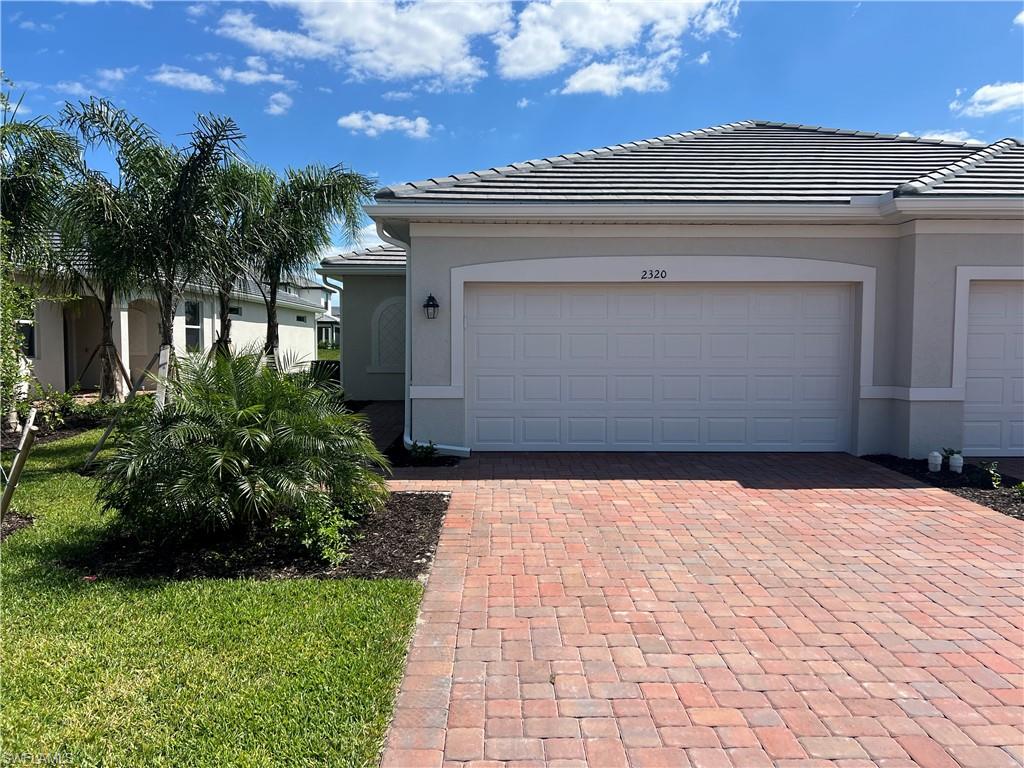 Available Now! This newly built Lennar "Magnolia" villa is located in the beautiful Orange Blossom Groves community and offers 1,417 square feet of living space. Featuring 3 bedrooms, 2 full bathrooms, a screened and pavered lanai, and a 2-car attached garage, this single-story home provides comfortable and modern living.
The open-concept floor plan includes a spacious kitchen with stainless steel appliances, a pantry, and a large island overlooking the dining and living areas. Additional features include a separate laundry room with washer and dryer, a primary suite with dual sinks, a walk-in shower, and a walk-in closet, along with two guest bedrooms that share a full bathroom with a tub/shower combination. Residents enjoy access to an array of community amenities, including a clubhouse, fitness center, playground, tennis courts, bocce ball courts, basketball court, volleyball court, and two community swimming pools. Conveniently located just minutes from Publix, CVS Pharmacy, Dunkin', and local schools. One small dog under 25 lbs. may be considered with owner approval. High-speed internet is included. Tenant is responsible for electric, water, cable, and all other utilities.
