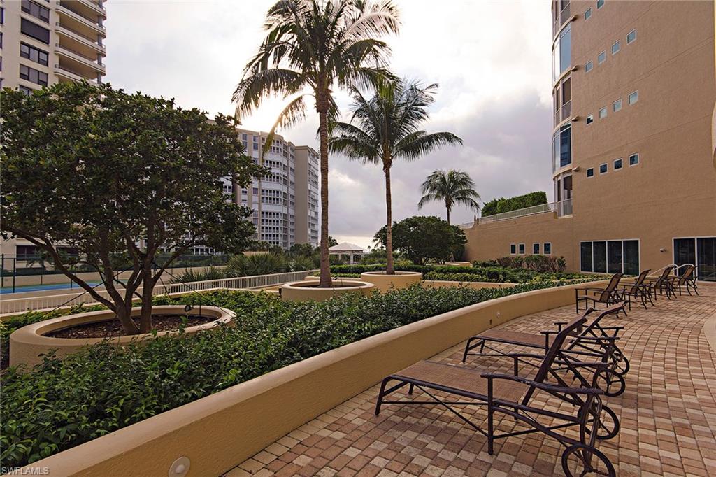 With an encircling terrace, this unique, sprawling third-floor condominium with 11.5-foot ceilings lives just like a beachfront home, but without all the upkeep. Imagine a relaxing, breezy evening on the patio with loved ones while overlooking the terrace gardens and Gulf of Mexico, or a brief trip down the exclusive-access walkway for a day at the pool or beyond to the beach. This turnkey furnished home boasts two master suites, multiple screened lanai areas and an open floor plan. It also offers custom built-ins with fireplace, travertine floors, cypress ceilings, marble and quartz countertops, a gas cooktop and a private two-car garage. The final build on Park Shore Beach, Aria is the epitome of luxury beachfront living. Close to The Village on Venetian Bay for exquisite waterfront dining and shopping, plus boat dockage at The Venetian Bay Yacht Club.