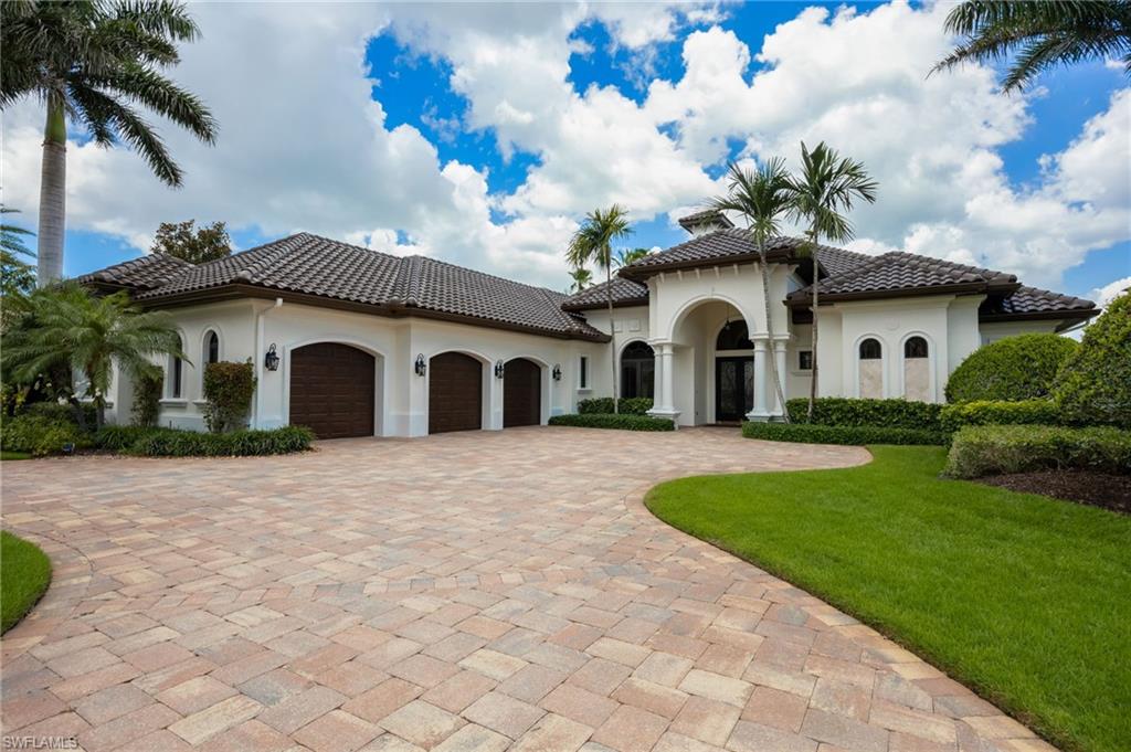 Welcome to an extraordinary estate in Quail West, where a Transferable Golf Membership is included with this award-winning residence. Recognized as the 2013 Model Home of the Year for Lee and Collier Counties, this exceptional property combines timeless elegance, luxury amenities, and breathtaking golf and lake views.
A grand foyer welcomes you through impressive double glass doors, immediately drawing your attention through the expansive outdoor living area, across the sparkling resort-style pool, and beyond to the 15th tee of the Lakes Course and a stunning lake backdrop.
Inside, every detail reflects superior craftsmanship and thoughtful design. Diagonal tile flooring flows throughout the main living areas, complemented by custom coffered and tray ceilings, recessed lighting, and pocketing sliding glass doors that seamlessly blend indoor and outdoor living.
The private den showcases rich custom wood flooring and an elegant, coffered ceiling, creating the perfect executive office or retreat. At the heart of the home, the chef's kitchen is designed to impress, featuring beautiful walnut cabinetry, premium Viking appliances, an oversized breakfast bar, a prep island with prep sink, abundant storage, and striking zero-corner sliding doors that open directly to the lanai.
Offering four spacious bedrooms, four full baths, and an additional powder room, this residence is ideal as either a full-time luxury home or an exceptional seasonal retreat. The primary suite serves as a private sanctuary, complete with dual walk-in closets, a morning bar with mini refrigerator, and even a massage chair. The spa-inspired primary bath features dual vanities, a large walk-through shower with three shower heads, a separate soaking tub, and dual water closets. Private lanai access allows for peaceful mornings and tranquil evenings overlooking the beautiful outdoor setting.
The expansive lanai is designed for year-round enjoyment, featuring a wood-paneled ceiling, generous seating areas, a fireplace, wall-mounted television, and a fully equipped outdoor kitchen with additional television, bar seating, and dining space. All of this surrounds the custom heated saltwater pool and spa, creating the ultimate entertaining environment.
Additional highlights include:
• Transferable golf membership included • Hurricane-rated windows and sliding doors • Indoor/outdoor Sonos  audio system • Electronic shades throughout • Offered fully furnished • Golf cart included.
Residents enjoy access to the unparalleled lifestyle of Quail West Golf & Country Club, a Platinum Club of America and one of only 150 clubs nationwide to receive this distinction. Amenities include an award-winning culinary program, full-service luxury spa, state-of-the-art fitness center, tennis and pickleball courts, bocce courts with covered seating, playground, and vibrant social gathering spaces designed to foster lasting friendships and an exceptional club lifestyle.