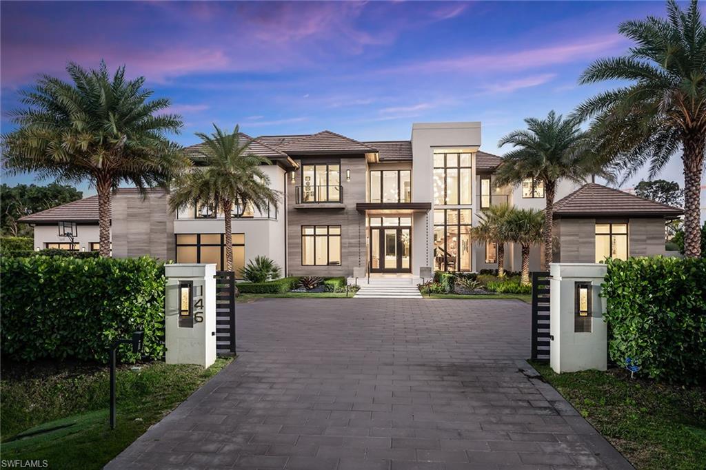 This one-of-a-kind, custom contemporary Pine Ridge estate, newly complete in 2021 features an inviting, clean, organic design with all the glamour and amenities of a five-star resort. Located on an oversized lot with lake view and lush landscaping, no detail was spared from subtle design to lux finishes and brilliant lighting. With an expansive open concept floorplan, large living spaces, 6 bedrooms, 8 full, 2 half baths plus den, clubroom and casita - this home is perfect for entertaining. The stunning Zebrawood kitchen with Sub-Zero/Wolf appliances and white Carrara marble backsplash has a large waterfall island. The main floor primary suite has dual baths and custom closets with courtyard leading to your private Zen-inspiring spa with cold plunge pool, steam sauna and a separate room for massages and workouts. There is a modern clubroom featuring a backlit agate bar and ample lounging space. Expansive pool and outdoor living with fireplace, outdoor kitchen, pizza oven, sunken conversation firepit and more. Gated driveway leads to a 5 car garage. Thoughtfully designed by Stofft Cooney with interior by Wilfredo Emanuel Designs.