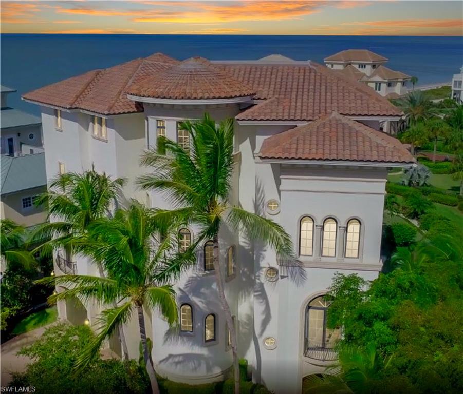 Unparalleled beachfront estate with incredible Gulf views in North Naples’ gated Barefoot Beach. This Collier County home sits on a nearly DOUBLE LOT, allowing a rare OPEN floor plan with AMPLE outdoor living spaces (3 Gulf-front lanais with grill, fireplace & TV). This newer construction home boasts the finest craftsmanship, from the soaring ceilings & impact resistant windows/doors, to the smart home technology with Control4 AV & zoned HVACs. A coastal contemporary designer’s delight, this masterpiece offers hardwood & travertine floors throughout, a soothing neutral color palette reminiscent of the Gulf just beyond, elegant coastal furnishings/décor & incredible natural light courtesy of a myriad of Gulf-facing windows. The unparalleled chef’s kitchen includes double islands, Wolf gas range, Subzero refrigerator, 2 dishwashers, dual sinks & more! INCREDIBLE floor plan with 4 living spaces, 2 master suites, tons of storage & UNMATCHED cloud-level master suite on its own private floor, with His & Hers closets, His & Hers bathrooms with steam shower & 2nd laundry. No detail left undone. Steps to beachfront pool & Club at Barefoot. Minutes to Mercato, Promenade & Waterside Shops.