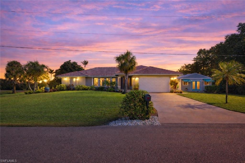 BACK ON THE MARKET, DUE TO BUYER FINANCING FALLING THROUGH- THEIR LOSS IS YOUR GAIN!

Discover island living with space to grow at 12070 Bohman Lane in Bokeelia. Tucked away in a peaceful and private setting, this property is zoned Agricultural, offering rare flexibility and opportunity on Pine Island. This is an extremely RARE lot with 1.3+ acres AND Gulf Access waterfront.  Whether you dream of building a second home, adding a barn, or keeping farm animals, this property provides the acreage and freedom to bring those visions to life.

Inside, the home features an open floor plan that feels airy and well-lit—perfect for entertaining guests or simply enjoying relaxed island living. The layout flows effortlessly, with sunset views right from the living room, creating the perfect end to every day. A dedicated studio space adds valuable flexibility, ideal for a home office, creative workspace, or additional living area.

The kitchen is thoughtfully designed for both cooking and gathering, featuring quality cabinetry with pantry storage, pull-out shelving, and soft-close doors. A beverage center with a wine fridge and bar sink makes hosting easy and enjoyable.

Step outside to appreciate the expansive acreage and lush landscaping, complete with mature palms, fruit trees, and updated plantings that enhance both beauty and privacy. There’s plenty of room for parking, boats, RVs, and storage, all supported by a well with irrigation system. The inviting lanai and patio offer true indoor-outdoor living with wide doors, no-see-um screens, an open rail system, and a relaxing hot tub—perfect for unwinding after a day on the water.

This home is ideally located close to the center of Pine Island, with easy access to local restaurants, shopping, the community pool, and pickleball courts, while still maintaining a tranquil, country feel. Enjoy nearby waterfront access for boating, fishing, beaches, and island hopping, along with quiet roads ideal for walking and biking.

Additional features include a sound system for TV viewing and music and thoughtful hurricane protection, including favorable elevation and shutters, offering peace of mind year-round.

This is a truly unique Pine Island property—combining privacy, versatility, and the relaxed island lifestyle with the joys of water frontage and Gulf access- all from the comfort of your home!