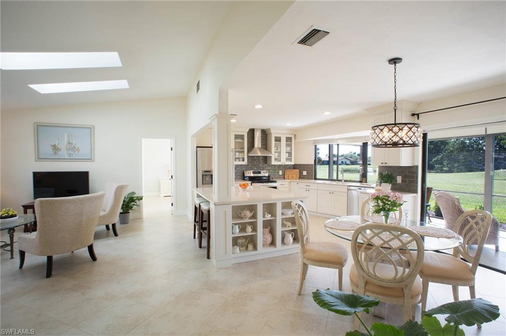 Welcome to the most beautiful villa in Lakewood. This sunlit open concept is illuminated by skylights in the high ceiling. One of the highlights is the beautiful kitchen island featuring quartz countertops. This home has been completely renovated and fully upgraded, new bathrooms and kitchen, a new hot water heater, a UV light cleaning AC, and much more. The spray insulation in the attic has cut the owner's electric bill in half. This gorgeous home features tiles throughout. The owners spared no expense on landscaping, with palm trees and bushes creating an enjoyable patio in the front and a paved area for lawn chairs in the back. This home lives like a single family with acres of green space and a pond in the rear. Less than a mile away, a quiet walking path takes you to Starbucks, Publix, restaurants, and more.