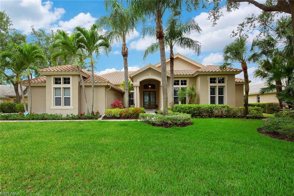 Enjoy sunsets over an incredible long, winding lake view that you'll never tire of. Spacious multi-deck pool/ spa area is perfect for entertaining and includes an electric awning to keep you in the shade. Well appointed and cared for with an updated master bath and kitchen, wood flooring, crown molding in many areas, updates in floor tile, both air conditioning units replaced, roof replaced in 2011 as well as the pool cage and heater in recent years. Features tall sliders with transom windows, mitered glass in areas, neutral colors throughout, three car side load garage and a plan that will accommodate either a  crowd or a couple. Note that impact windows are in the guest suites only. The intercom system and the fireplace are not warranted by the seller. The formal living and dining area furniture, the guest suite twin beds and the breakfast nook dining set may be purchased separately from the home.