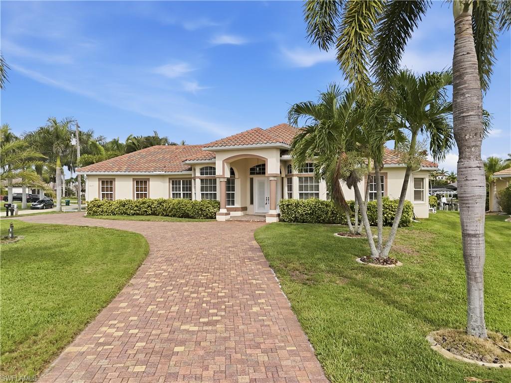 Discover luxury waterfront living in this Gulf-access pool home located in the prestigious Oasis Boulevard area of Cape Coral, surrounded by elegant upscale residences and known for its prime boating location. This beautifully maintained 3-bedroom, 3-bath home with a 3-car garage offers the perfect blend of comfort, functionality, and the sought-after Southwest Florida lifestyle.
A circular paver driveway, framed by mature palm trees and lush tropical landscaping, creates exceptional curb appeal and a grand first impression. Inside, each of the three spacious bedrooms features its own en-suite bathroom, providing privacy and convenience for family and guests alike.
In addition to the bedrooms, the home offers two versatile dens, ideal for home offices, a formal dining room, media room, hobby space, or additional guest accommodations. The bright, well-appointed kitchen is designed for entertaining and everyday living, featuring Corian countertops, stainless steel appliances, a center island, abundant cabinetry, and the convenience of TWO wall ovens.
The kitchen seamlessly flows into the expansive great room, where large windows and sliding glass doors frame views of the outdoor oasis. Step outside to the pavered lanai with a pool and separate heated spa, creating the perfect setting for relaxing, entertaining, and enjoying Florida's year-round sunshine. Lush tropical landscaping provides added beauty and privacy, while plantation shutters throughout the home, including on the sliding doors, add timeless elegance and style.
For boating enthusiasts, the private dock with a 7,000-pound boat lift offers direct Gulf access, making it easy to spend the day exploring Southwest Florida's waterways, beaches, and world-class fishing destinations.
Recent updates provide additional peace of mind, including a new roof (2023), new pool cage (2023), HVAC replacement (2022), and fresh interior paint.
If you're searching for a Cape Coral Gulf-access home with a pool, boat lift, 3-car garage, and flexible living space in one of the city's most desirable waterfront neighborhoods, this exceptional Oasis Boulevard property is a must-see.
Schedule your private showing today and experience the ultimate Florida boating lifestyle.