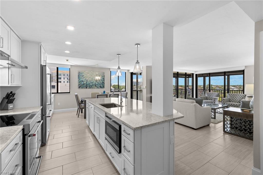 This fully remodeled 5th-floor corner end unit offers an exceptional coastal retreat with beautiful Gulf and bay views, an open-concept floor plan, and expansive wraparound screened lanais designed to embrace the best of indoor-outdoor living. Positioned to capture views from multiple exposures, the residence is filled with natural light and offers a rare sense of privacy, space, and serenity. Enjoy Gulf views from the primary suite and tranquil bay views from the guest bedroom, creating a stunning backdrop for relaxed Naples living and effortless entertaining. Offered turnkey, this residence is ready to be enjoyed immediately and features a generous rental policy allowing 30-day minimum rentals up to 12 times per year.

Vanderbilt Bay offers a private bay-side pool, tennis and pickleball court, and onsite docks available upon availability, making it an ideal setting for those seeking both beach and boating access. Walk directly across the street to your deeded access to Vanderbilt Beach, or enjoy close proximity to some of Naples’ most beloved destinations, including La Playa Beach Resort, The Turtle Club, and The Ritz-Carlton. Mercato is just moments away, offering boutique shopping, dining, entertainment, and Whole Foods. With its coveted beach-and-bay location, beautifully remodeled interiors, and access to an exceptional Naples lifestyle, this residence presents a rare opportunity in one of North Naples’ most desirable coastal settings.