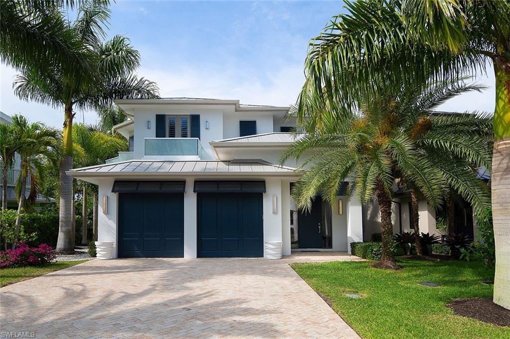 Welcome to the most exquisitely redesigned home in the Moorings, one of the most sought-after communities in Naples. Upon entry you will be immediately impressed by the openness and contemporary, yet very inviting sophisticated finishes. The interior and exterior of this home have been recently painted a serene and neutral color palette to compliment the newly installed Custom Legno Bastone Wide Plank Wood Flooring to ensure timeless elegance. The kitchen is equipped with a very large island, a Wolf Range and Convection Oven and a Subzero Refrigerator/Freezer as well as a Subzero Wine Refrigerator. The luxurious owner’s suite is located on the first floor, while the second floor offers a second owners suite and two beautifully appointed guest bedrooms all with en suite baths. Upstairs you will find four balconies and a large bonus room which makes for a great upstairs family room. This is the perfect home for a large family or the couple that loves to entertain. THIS PROPERTY SUSTAINED NO STORM DAMAGE.