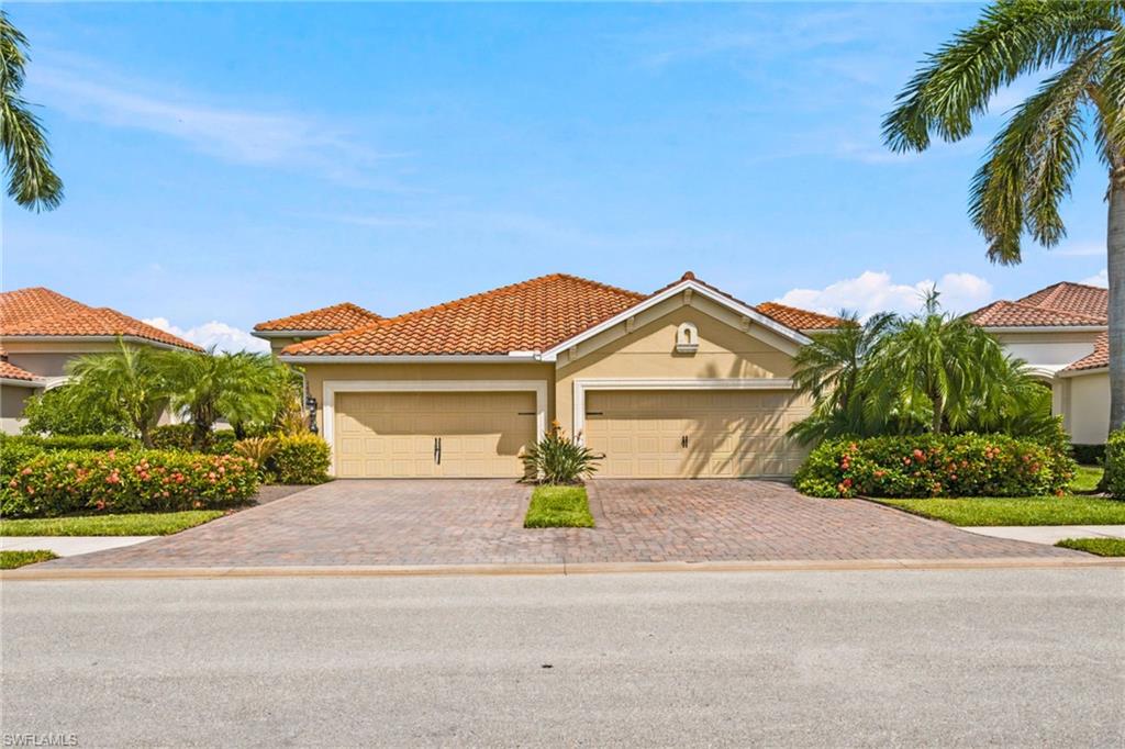 A rarely available upgraded throughout attached villa on a premium lake lot in the highly desirable Reflection Lakes of Naples, offering breathtaking long lake views on your extended Lani. The property stands out with its builder upgrades and upgraded finishes throughout. This is a villa that when built was checked on every box for upgrades. Featuring 2 spacious bedrooms plus a versatile den / office, 2 bathrooms, and a 2-car attached garage. The living space is enhanced by elegant plantation shutters, newer appliances. There is tile throughout the main living areas and plank flooring in the bedrooms, office and even the garage has upgraded epoxy flooring. The lanai has and auto roll-down hurricane fabric screen, making it your ideal year-round outdoor sanctuary. Accordion shutters provide full storm protection and peace of mind and easy readiness when needed. Reflection Lakes including a resort-style pool, fitness center, and clubhouse. All of this is just minutes from Naples’ best shopping, dining, and entertainment destinations including 5th Avenue, Mercato, and Waterside Shops, and only a short drive to the area’s world-renowned beaches