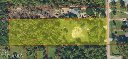 Build your dream home on this beautiful 2.73-acre parcel in one of Golden Gate Estates' most desirable and rapidly growing areas. With an impressive 181 feet of frontage this property offers the perfect combination of privacy space and convenience with no HOA.

The previous home has been removed creating a great opportunity to build on a homesite that is already partially cleared while still offering the privacy and natural beauty that Golden Gate Estates is known for. Approximately half of the property has been cleared while the remaining acreage provides mature trees and a peaceful setting. The generous width and depth give you plenty of room for your custom home guest house workshop RV garage pool gardens and more.

The property has been lovingly maintained and features mature landscaping numerous established fruit trees two separate driveways and an existing well on site. It is a beautiful park-like setting that would take years to recreate.

Enjoy the peace and privacy of country living while still being just minutes from shopping dining entertainment schools and everything Naples has to offer including world-famous white sand beaches championship golf boating and beautiful Gulf sunsets.

Don't miss this opportunity to own a beautiful piece of Golden Gate Estates and build the home you've always dreamed of.