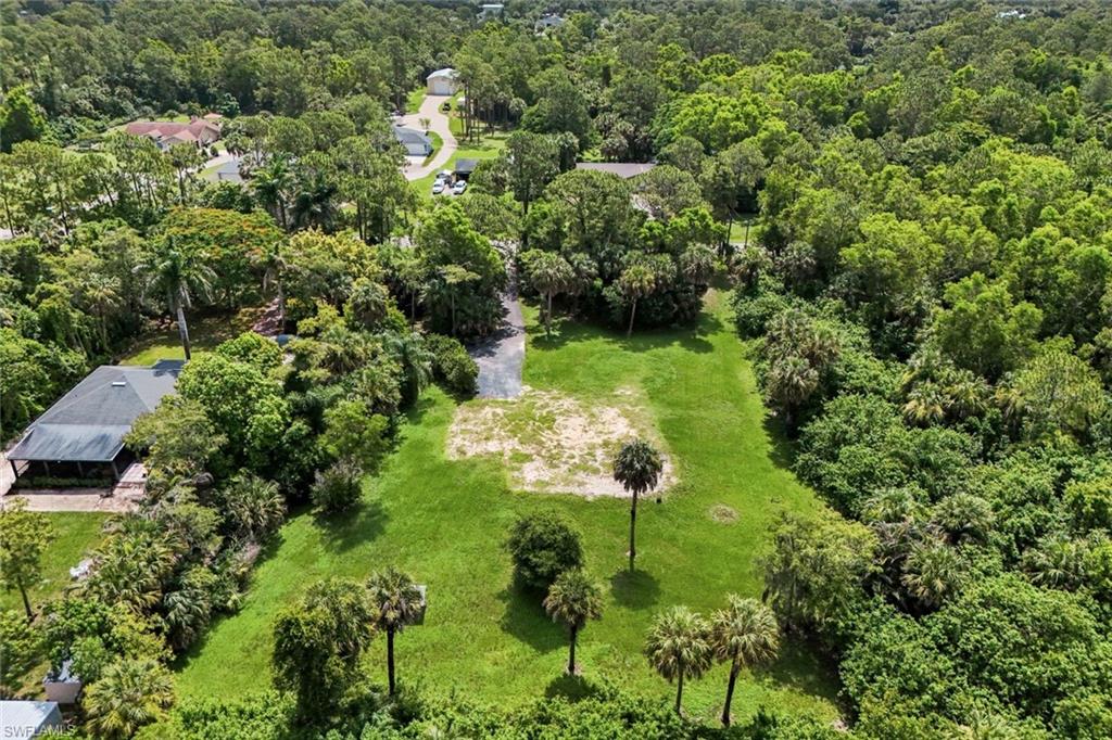 Build your dream home on this beautiful 2.73-acre parcel in one of Golden Gate Estates' most desirable and rapidly growing areas. With an impressive 181 feet of frontage this property offers the perfect combination of privacy space and convenience with no HOA.

The previous home has been removed creating a great opportunity to build on a homesite that is already partially cleared while still offering the privacy and natural beauty that Golden Gate Estates is known for. Approximately half of the property has been cleared while the remaining acreage provides mature trees and a peaceful setting. The generous width and depth give you plenty of room for your custom home guest house workshop RV garage pool gardens and more.

The property has been lovingly maintained and features mature landscaping numerous established fruit trees two separate driveways and an existing well on site. It is a beautiful park-like setting that would take years to recreate.

Enjoy the peace and privacy of country living while still being just minutes from shopping dining entertainment schools and everything Naples has to offer including world-famous white sand beaches championship golf boating and beautiful Gulf sunsets.

Don't miss this opportunity to own a beautiful piece of Golden Gate Estates and build the home you've always dreamed of.