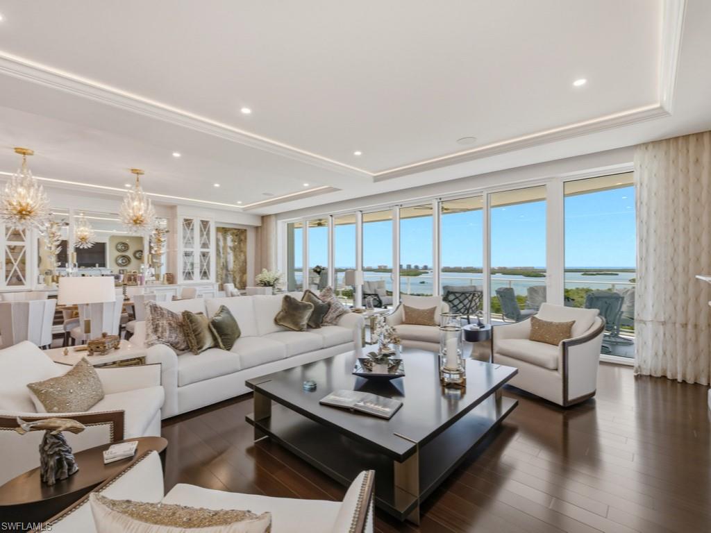 Experience the pinnacle of luxury and privacy in Bonita Bay—Omega 902.  A spacious home with over 4,210 square feet of amazing living space under air, with 3 bedrooms plus Den, Office and 3 1/2 baths.  This elegant home features many high-end finishes and furnishings, top quality furniture by Robb & Stuckey and Clive Daniels (all fabrics were custom ordered), Crystallo Bar Counter with LED Lighting, induction cooktop, Pompeii Quartz Volaza kitchen island and countertops, California closets, feature fire place, SONOS, Mirage African Mahogany wood floors and much more.  Enjoy outdoor dining and ever-changing sunsets over the Estero Bay and the Gulf of Mexico from your over-sized terrace, with electric hurricane shutters.  The home also features an air-conditioned private 2-car garage located on level 2 of the secure parking garage, just a short elevator ride away.  An extra garage parking space (in addition to the private garage) is included.  2 separate air-conditioned storage spaces are also included.  Designed by Miami-based architect Robert Swerdroe and rising 26 stories, Omega features only 3 residences per floor (67 residences total) offering low density in an exclusive setting.  The home offers unobstructed, panoramic views of the Estero Bay and the Gulf of Mexico beyond. Omega has 24-hour reception services in the lobby, with on-site management, maintenance staff and house keeping staff, for a true concierge experience.  Amenities at Omega include a resort-style pool,  men’s and women’s spas with steam room, fitness room, billiards room, and large private social room. Private guest suites are available for your overflow guests.  Enjoy special times entertaining your friends and family in the large rooftop terrace of Omega--with 2 outdoor kitchens with bar and relaxation area and 2 spas.  Residents in Bonita Bay enjoy 12+ miles of walking/biking paths and 3 nature parks, plus the new, private Bonita Bay beach club on the Gulf of Mexico. Optional Bonita Bay Club features world-class golf (5 courses), tennis/pickleball, clubhouse with gourmet dining, and 6,000 sq.ft. Lifestyle Center with spa services and fitness staff.  This home is located in a quiet and peaceful natural setting, but is within easy reach of gourmet dining and shopping, and the RSW International Airport.  You must experience this home in person to appreciate how truly special it is.  Note: Private showings are arranged by appointment only.